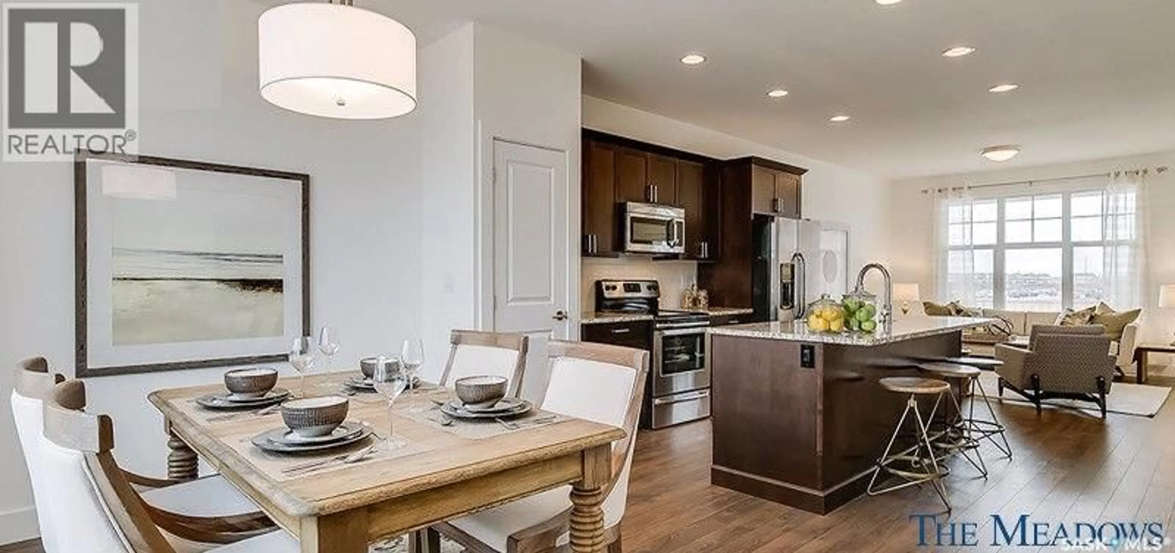 Open concept kitchen, wood/laminate floor for 447 EATON LANE, Saskatoon Saskatchewan S7V0H5