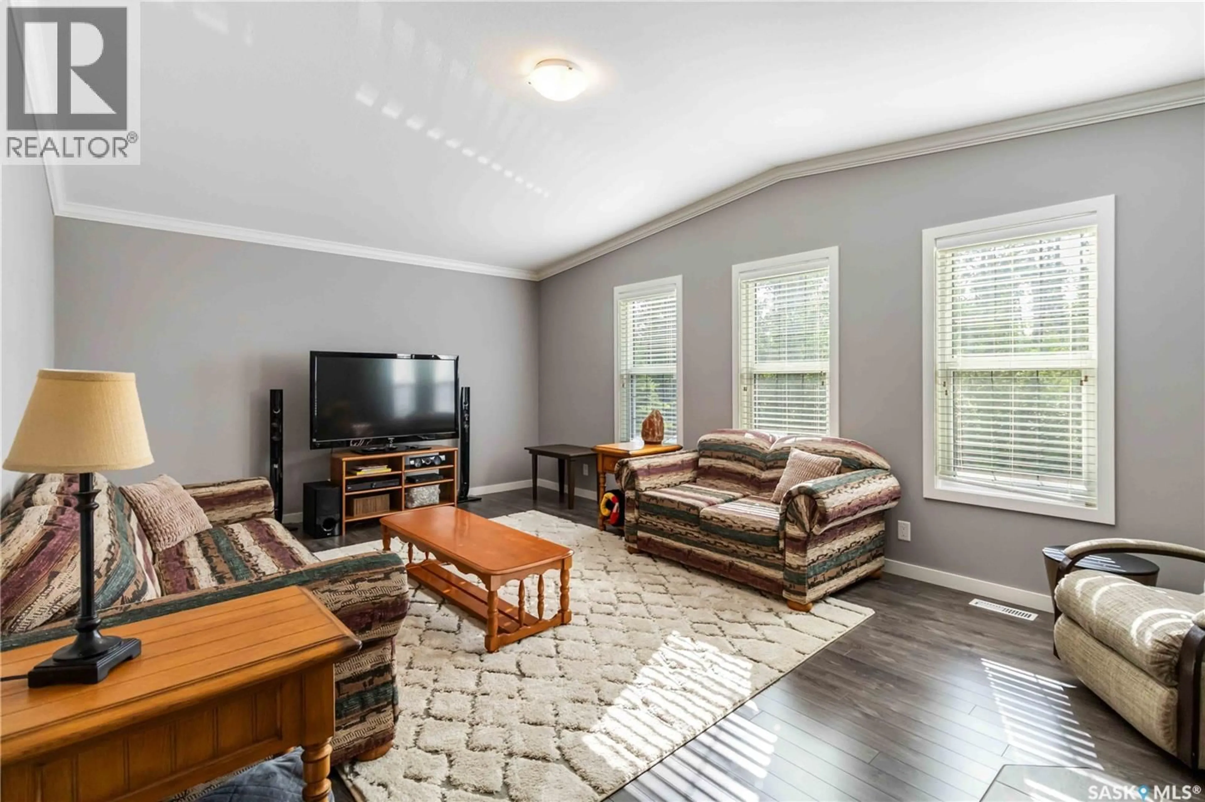 Living room with furniture, wood/laminate floor for 108 SUNRISE CRESCENT, Paddockwood Rm No. 520 Saskatchewan S0J0N0