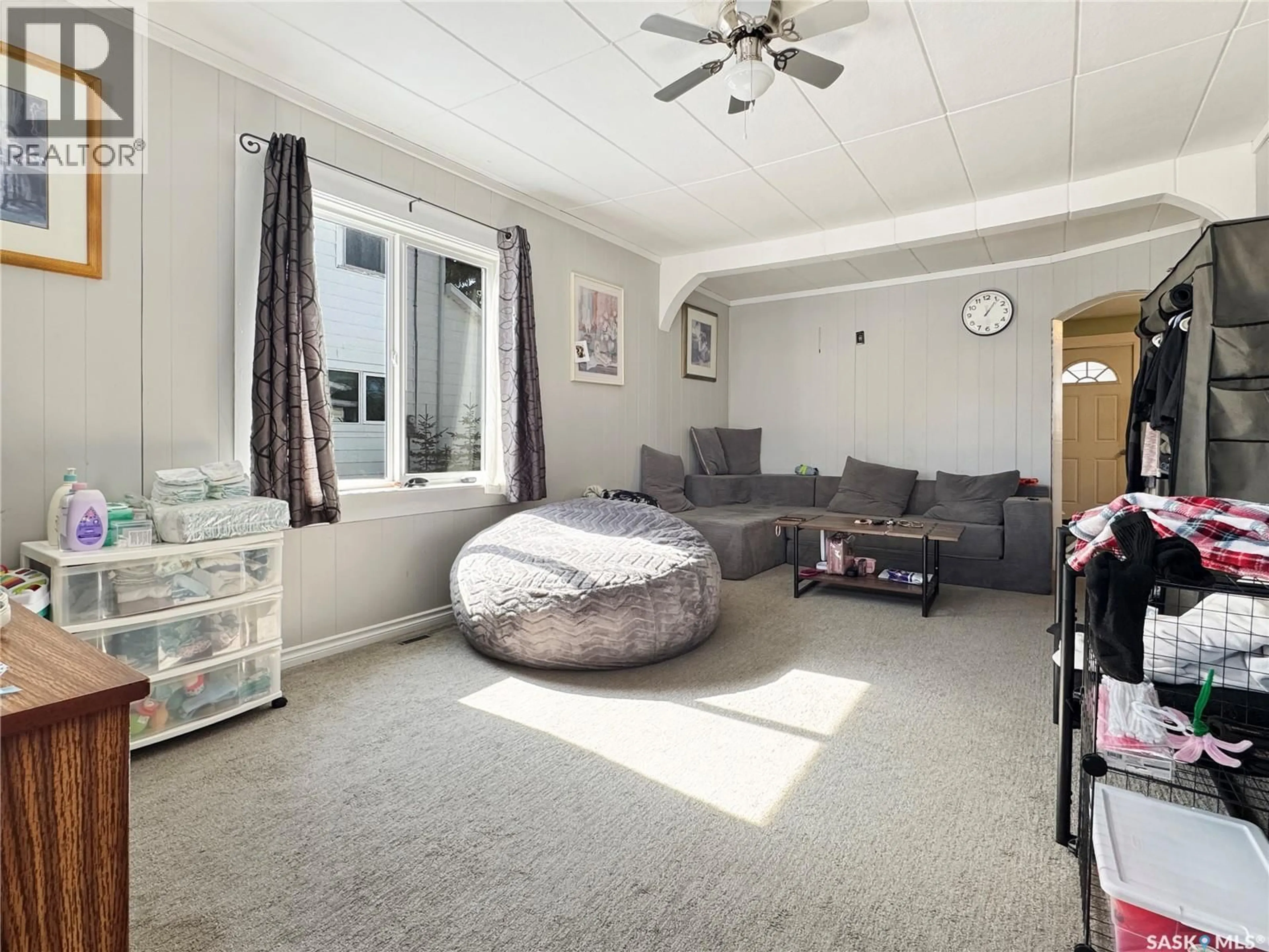 Living room with furniture, carpet floor for 1441 103RD STREET, North Battleford Saskatchewan S9A1L2