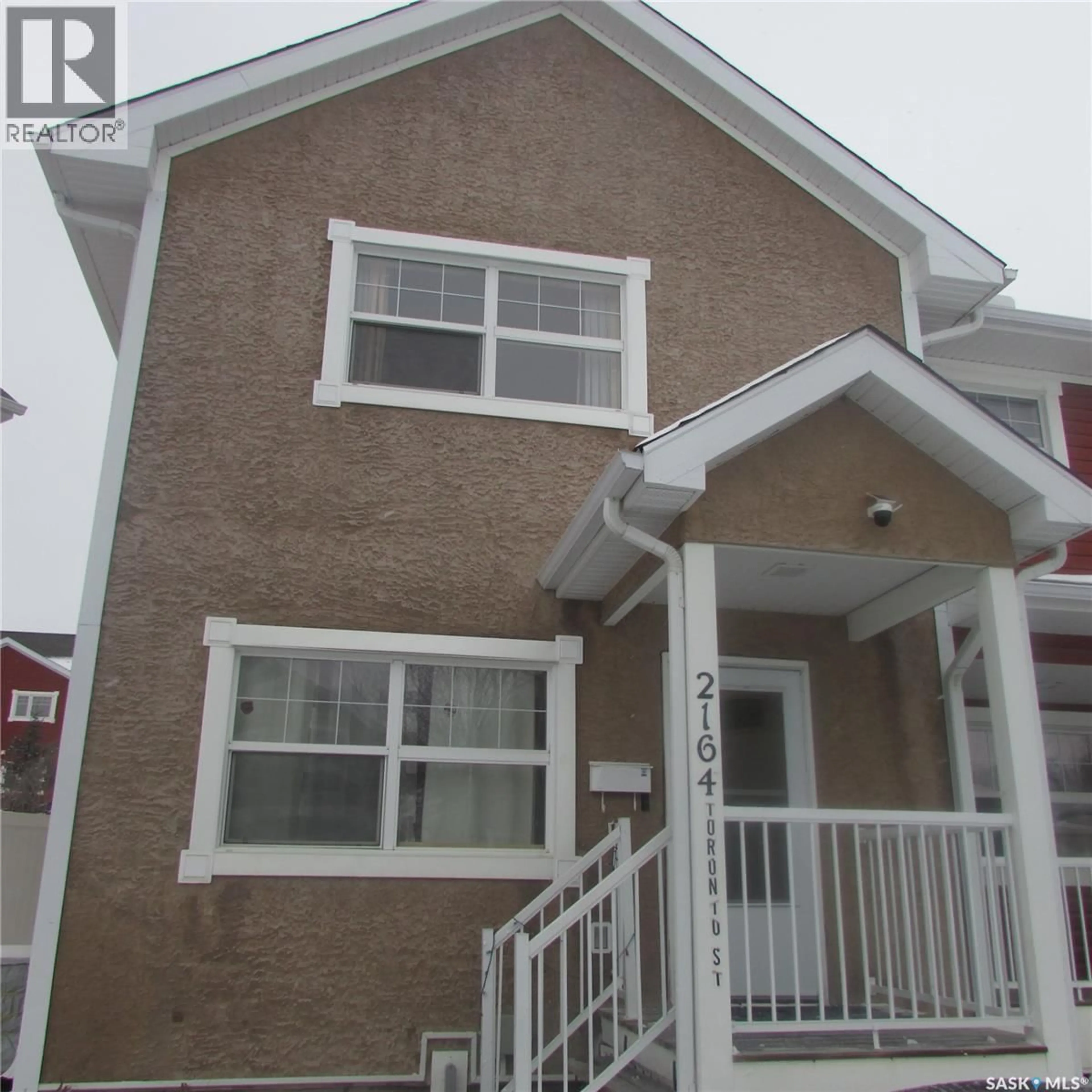 Home with vinyl exterior material, street for 2164 TORONTO STREET, Regina Saskatchewan S4P0B8