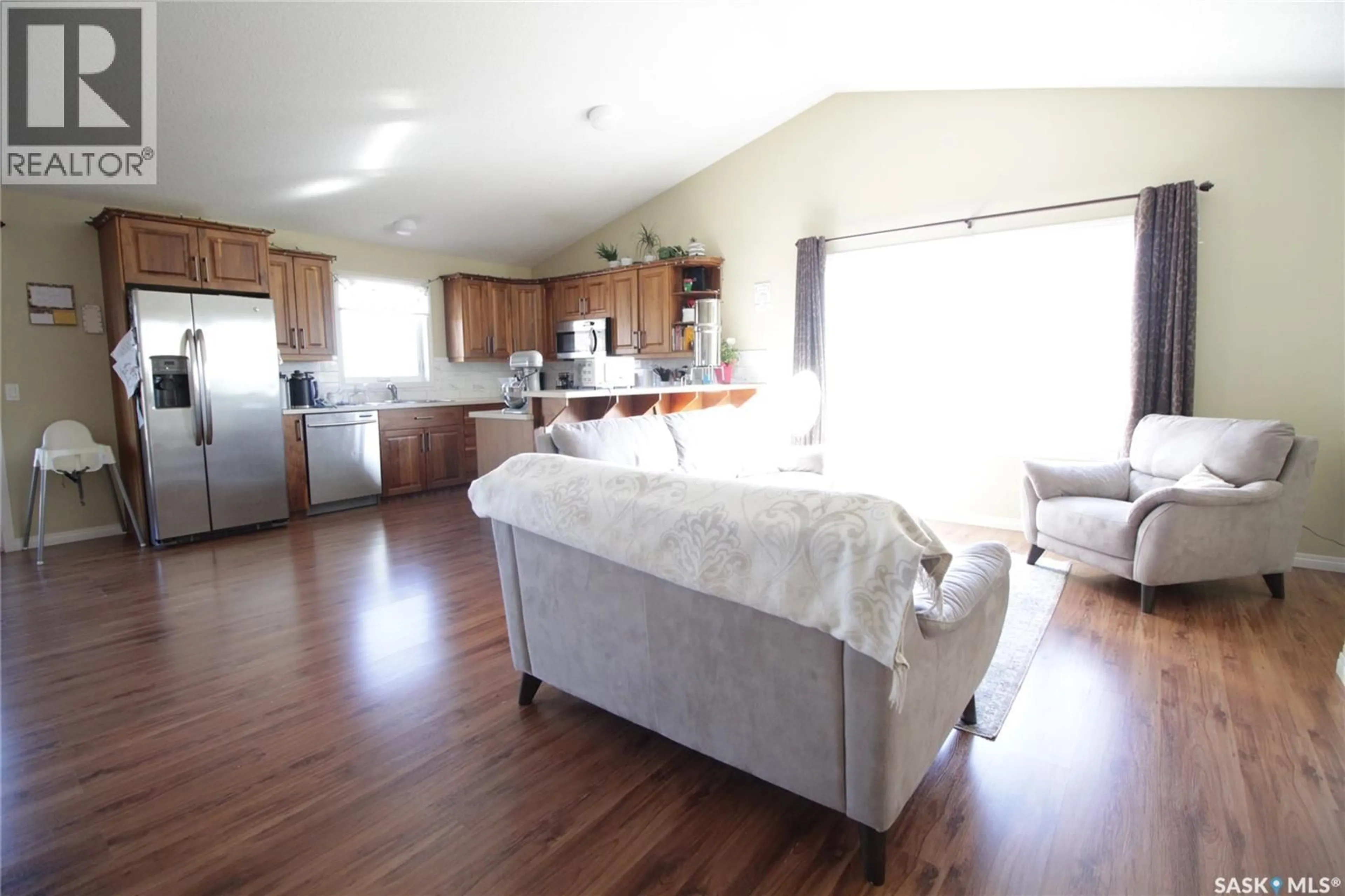 Open concept kitchen, wood/laminate floor for 113 ROBERTSON STREET, Maryfield Saskatchewan S0G3K0