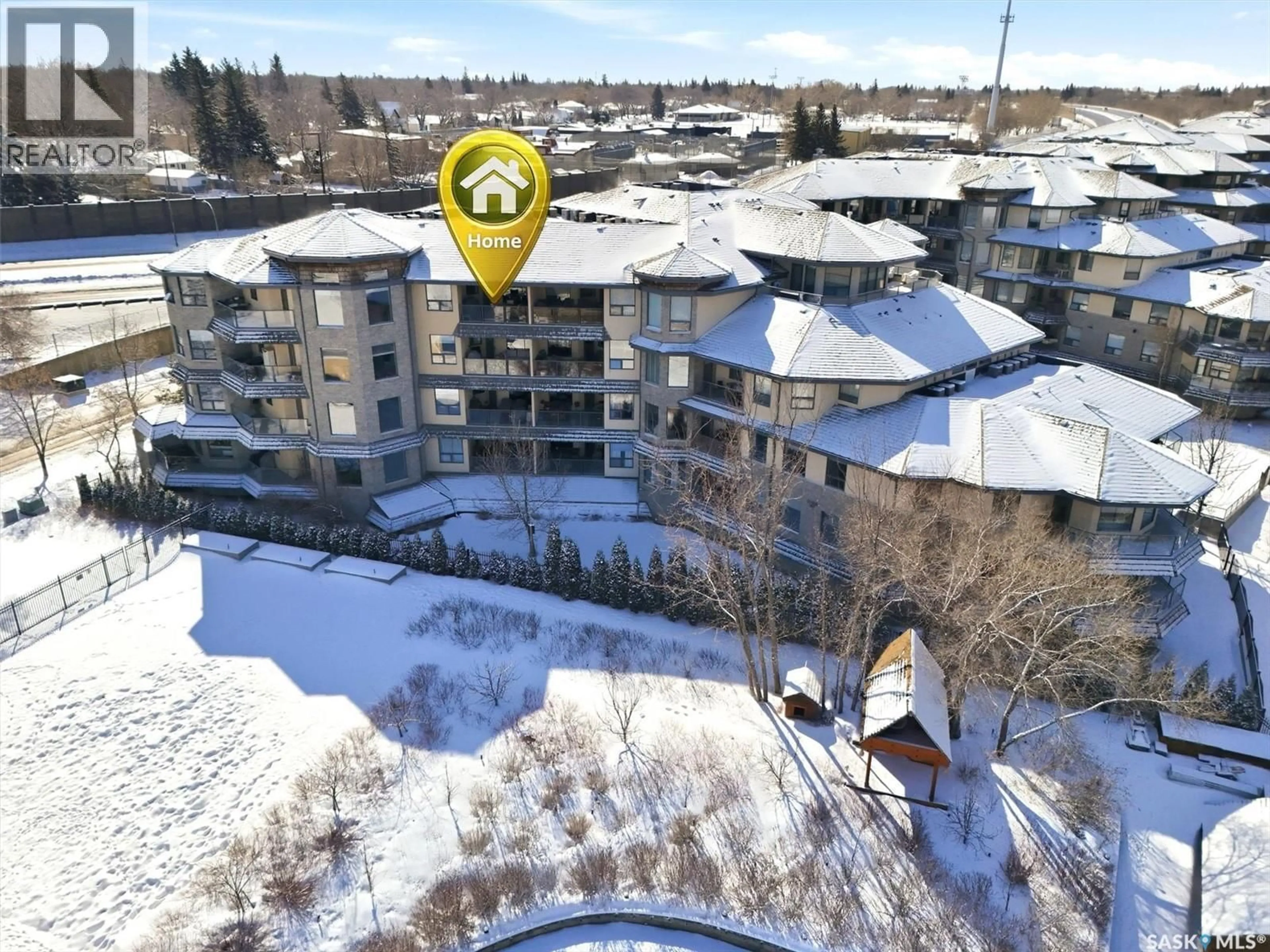 A pic from outside/outdoor area/front of a property/back of a property/a pic from drone, unknown for 402 615 SASKATCHEWAN CRESCENT, Saskatoon Saskatchewan S7M0A5