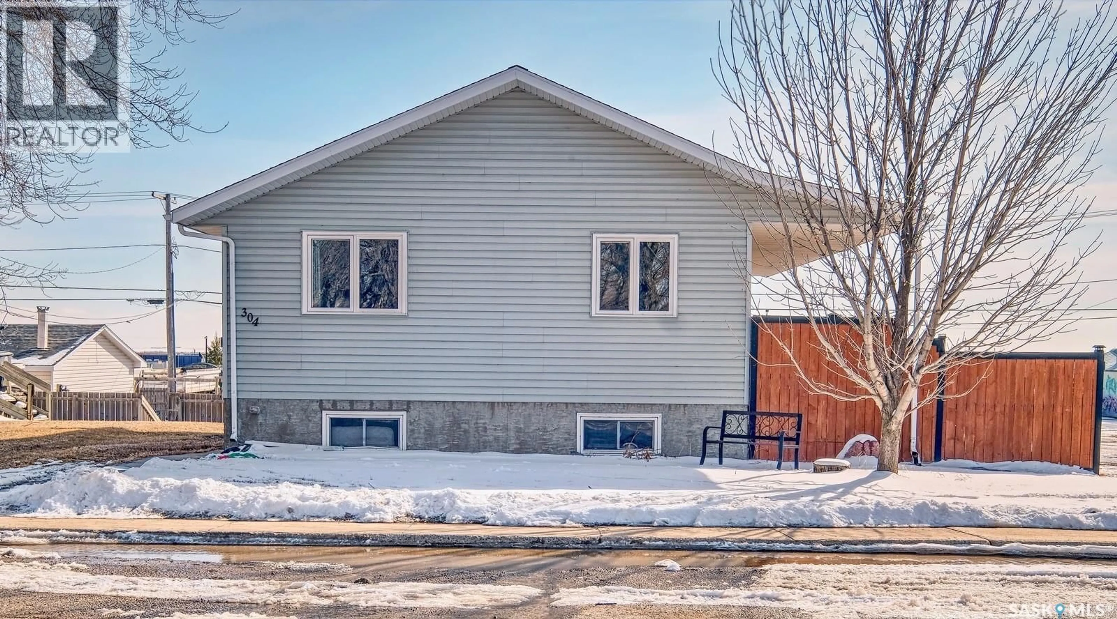 Home with vinyl exterior material, street for 304 2ND AVE, Biggar Saskatchewan S0K0M0