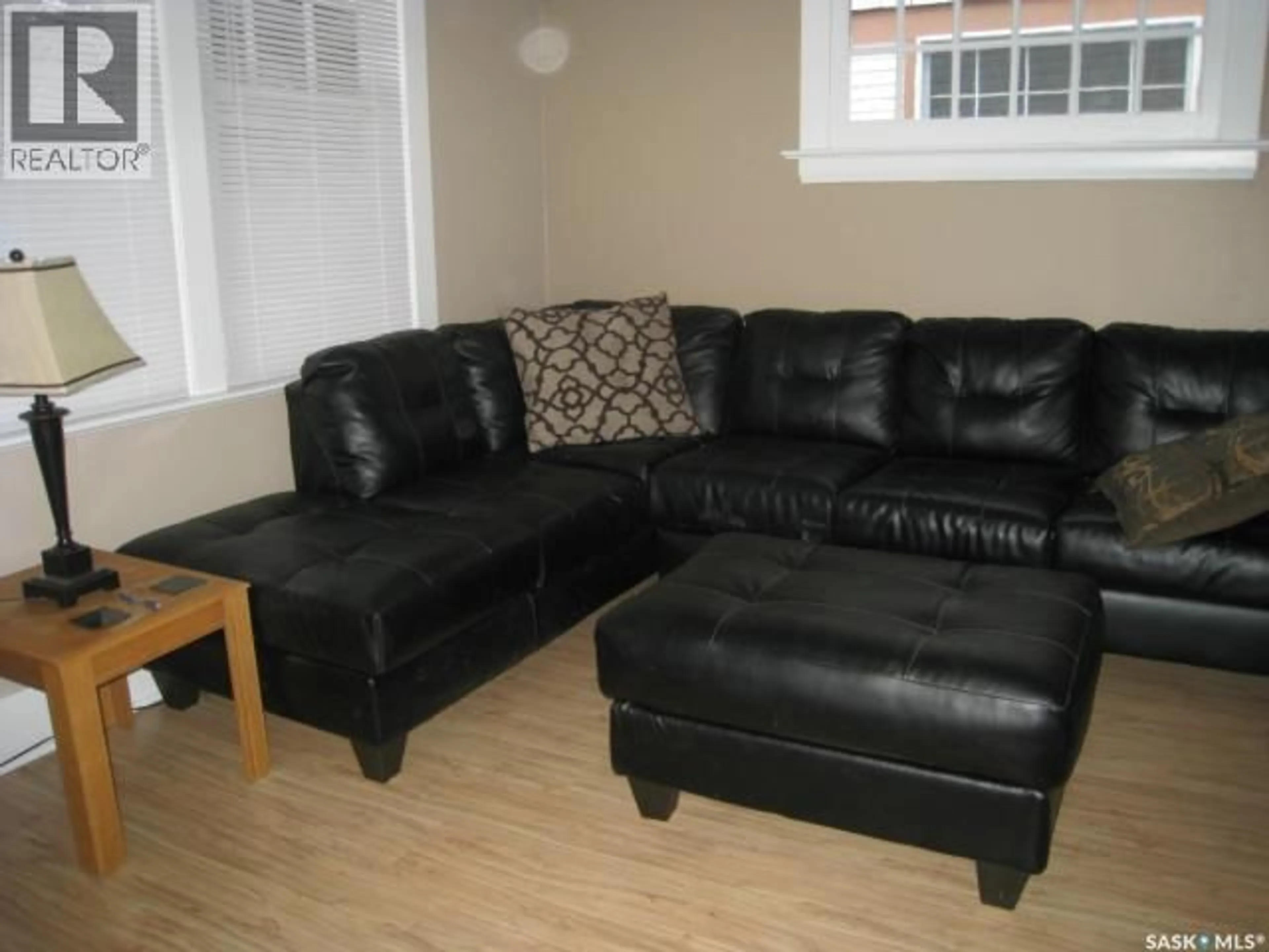 Living room with furniture, wood/laminate floor for 1437 ARGYLE STREET, Regina Saskatchewan S4T3S2
