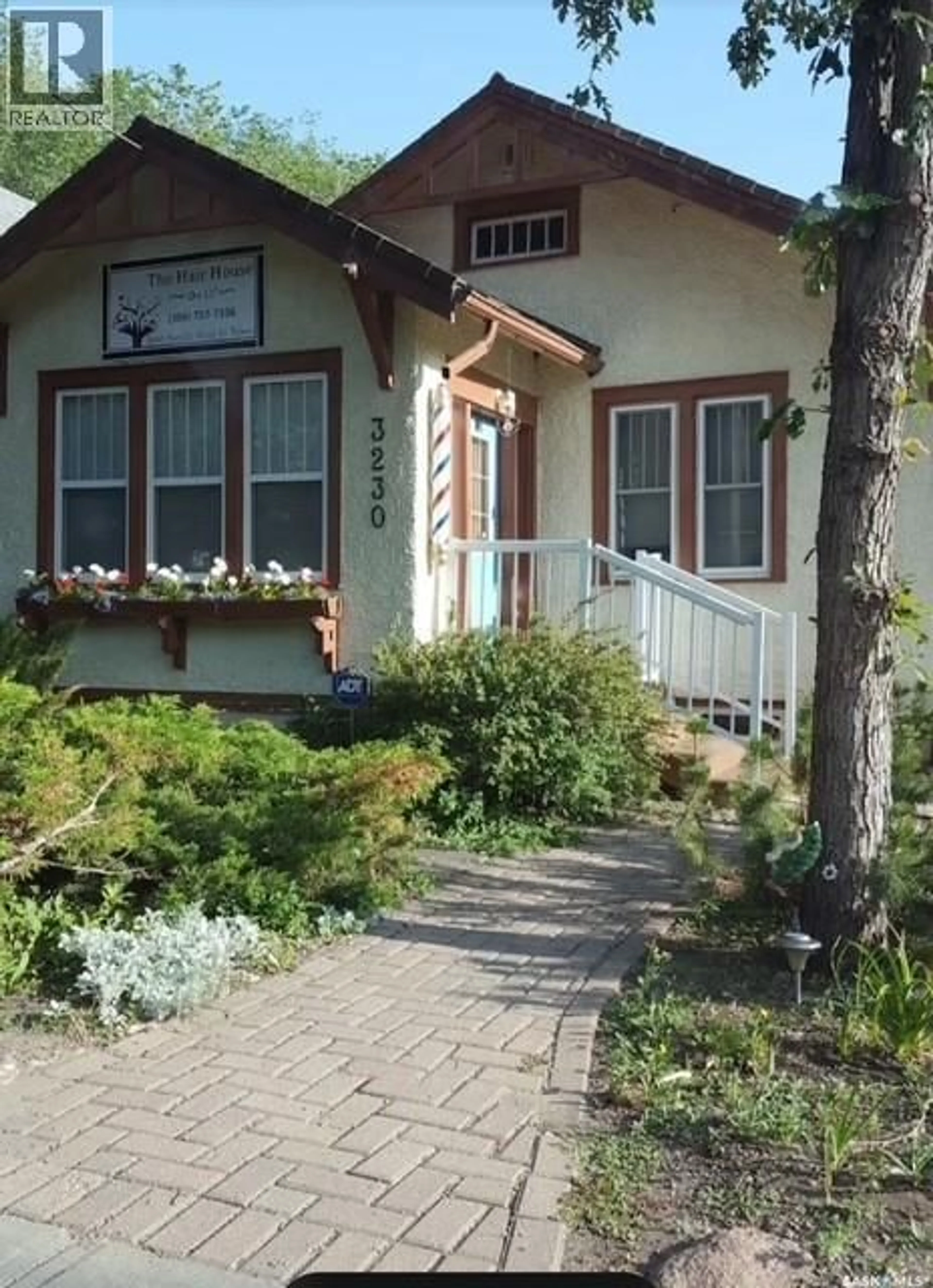 Home with vinyl exterior material, street for 3230 13TH AVENUE, Regina Saskatchewan S4T1P4
