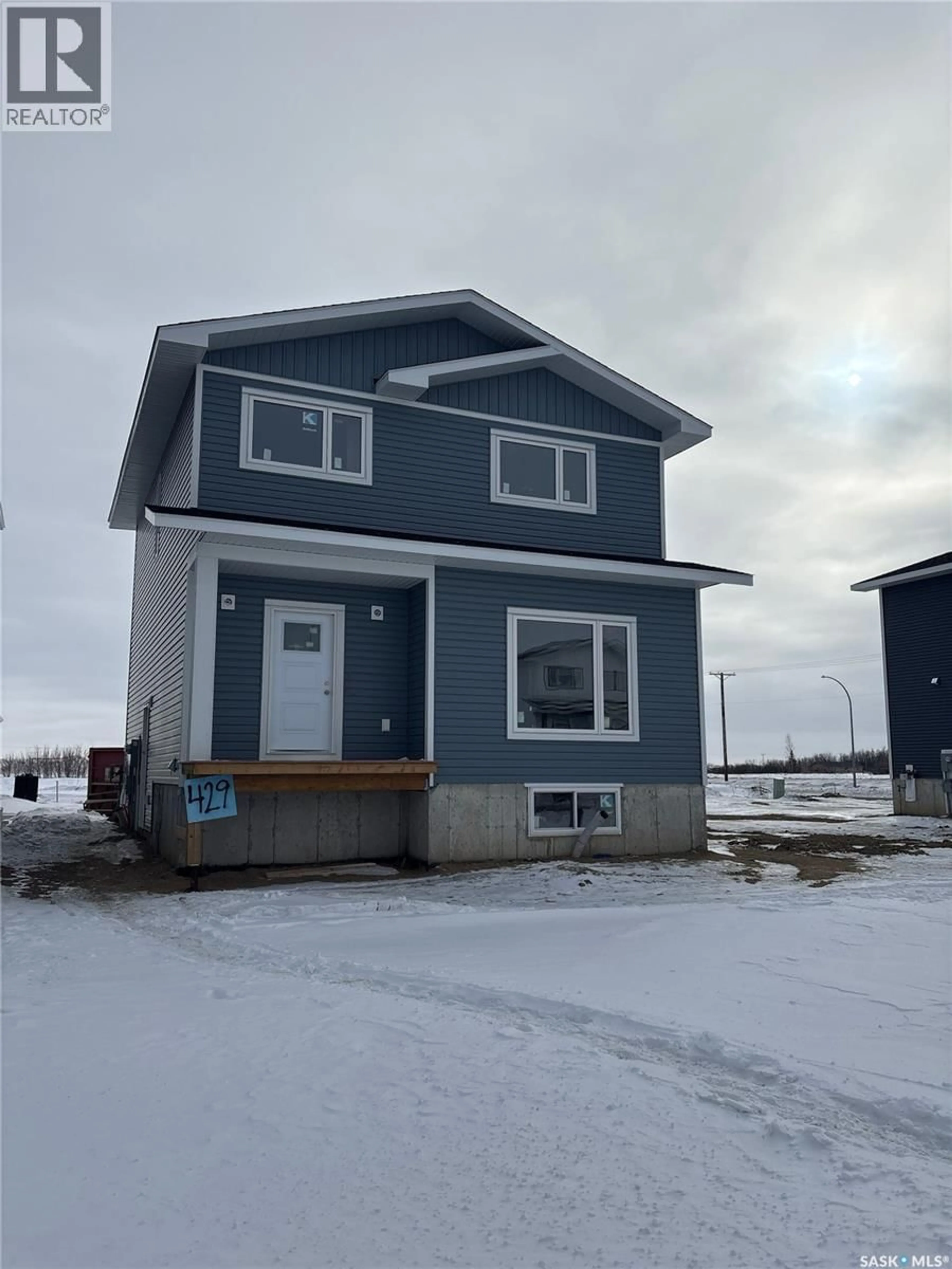 Home with vinyl exterior material, street for 429 ELDORADO STREET, Warman Saskatchewan S0K4S3