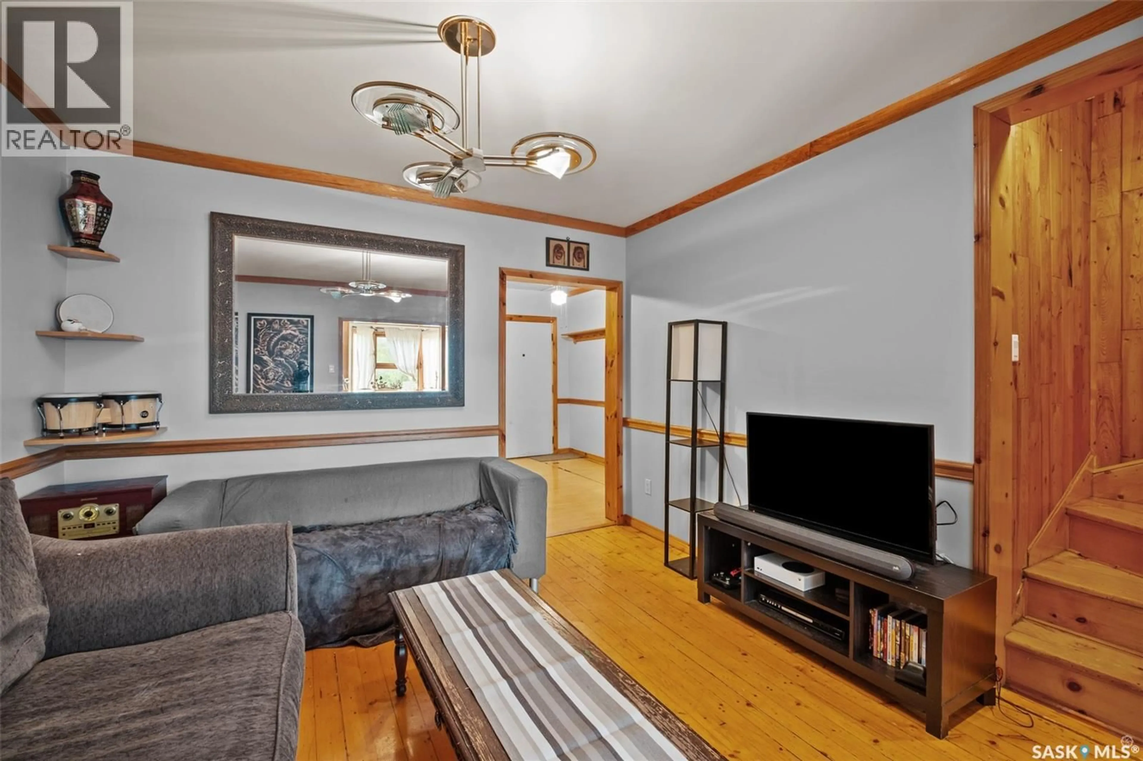 Living room with furniture, wood/laminate floor for 546 7TH STREET, Prince Albert Saskatchewan S6V0S5