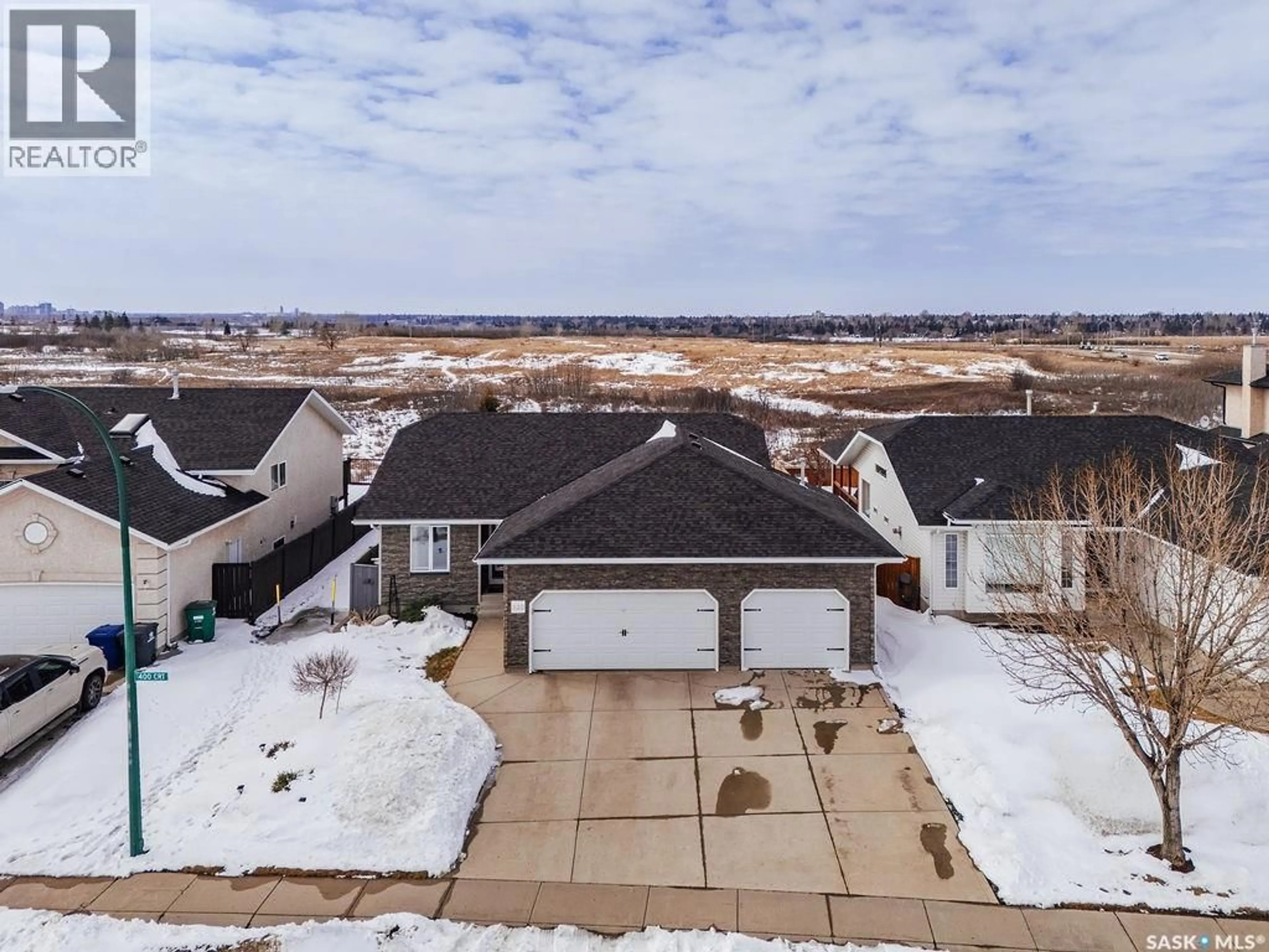 A pic from outside/outdoor area/front of a property/back of a property/a pic from drone, unknown for 330 POBRAN CRESCENT, Saskatoon Saskatchewan S7S1L4