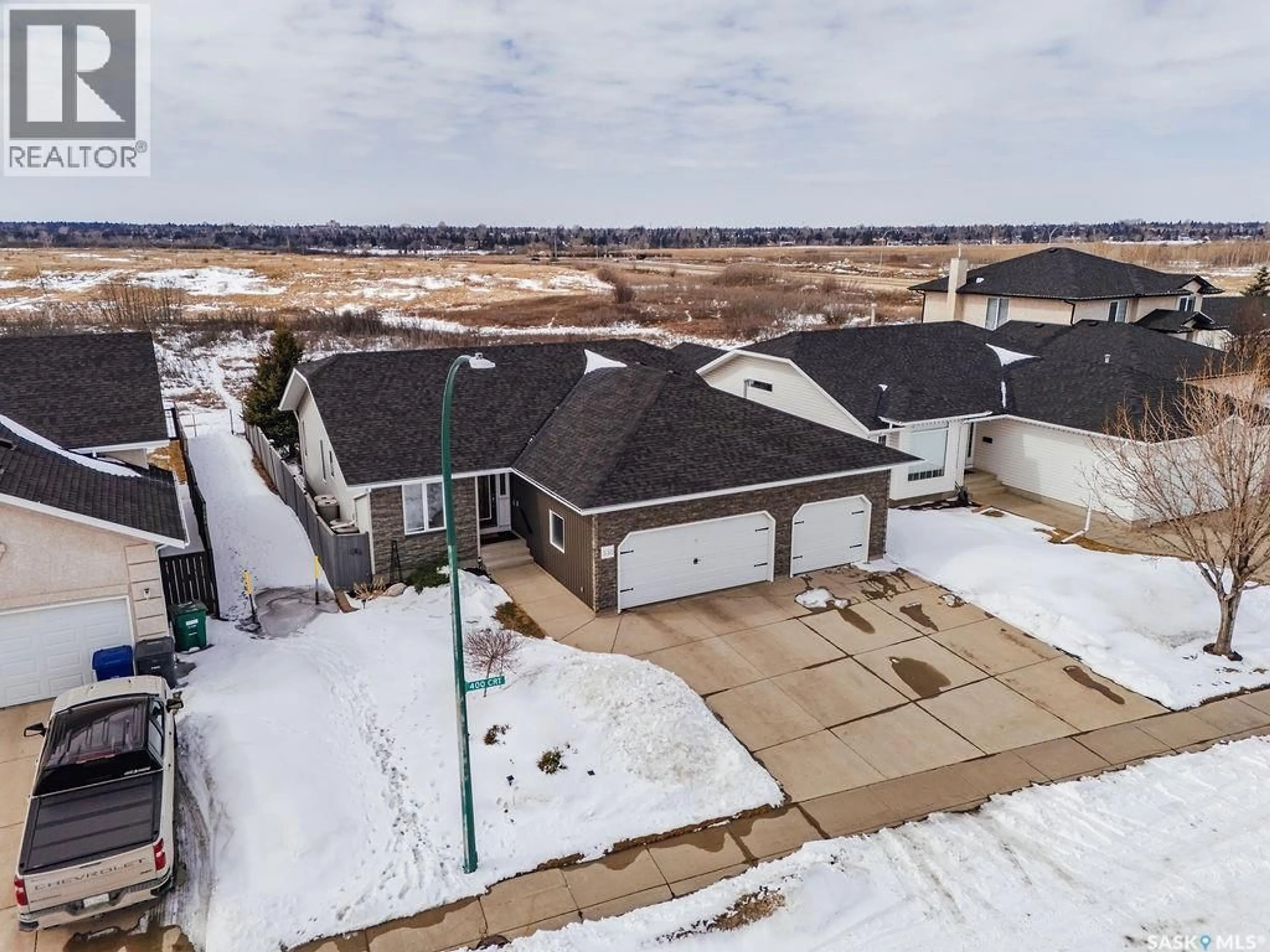 A pic from outside/outdoor area/front of a property/back of a property/a pic from drone, street for 330 POBRAN CRESCENT, Saskatoon Saskatchewan S7S1L4
