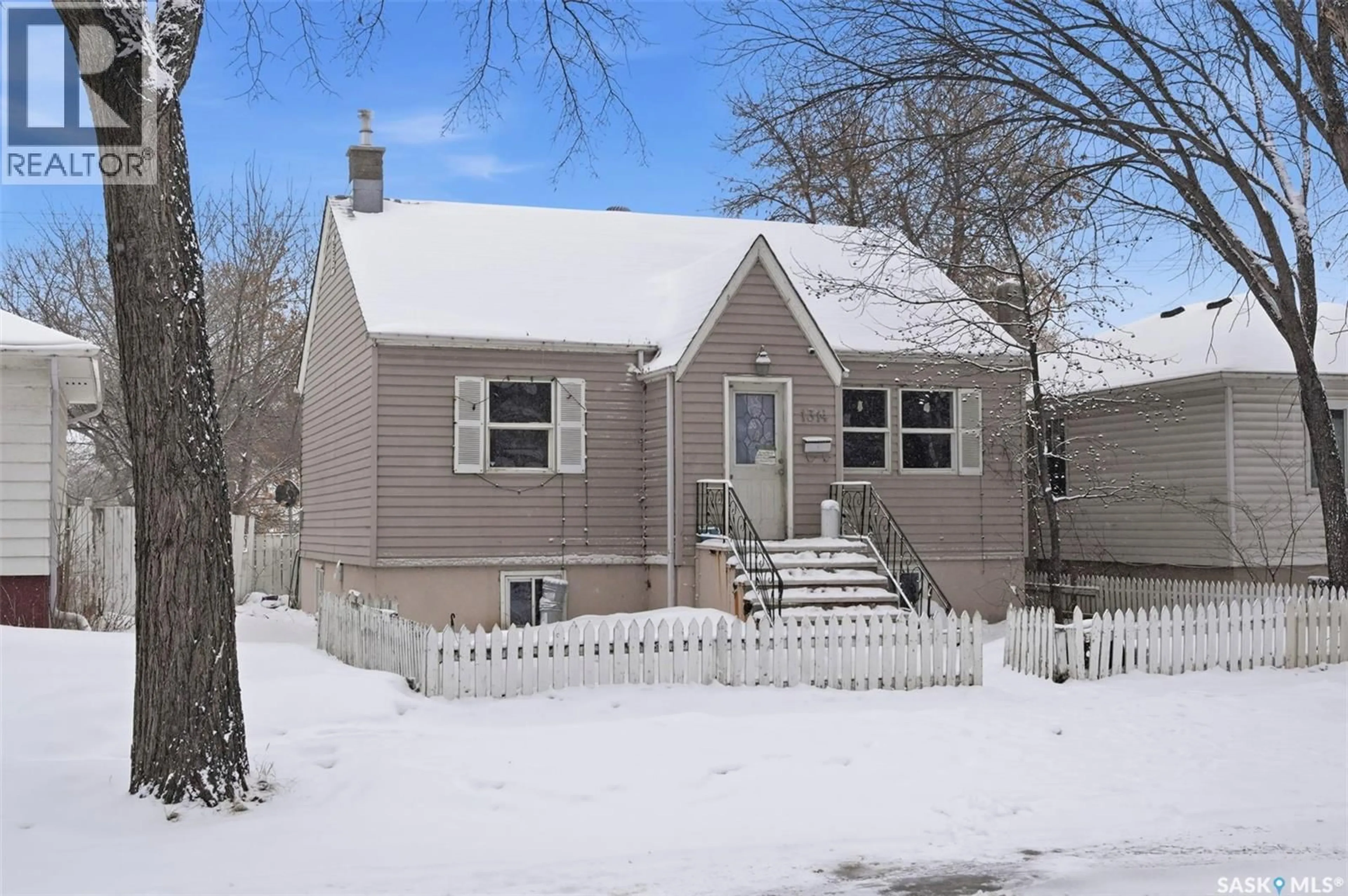 Home with vinyl exterior material, street for 1314 B AVENUE, Saskatoon Saskatchewan S7L1G5