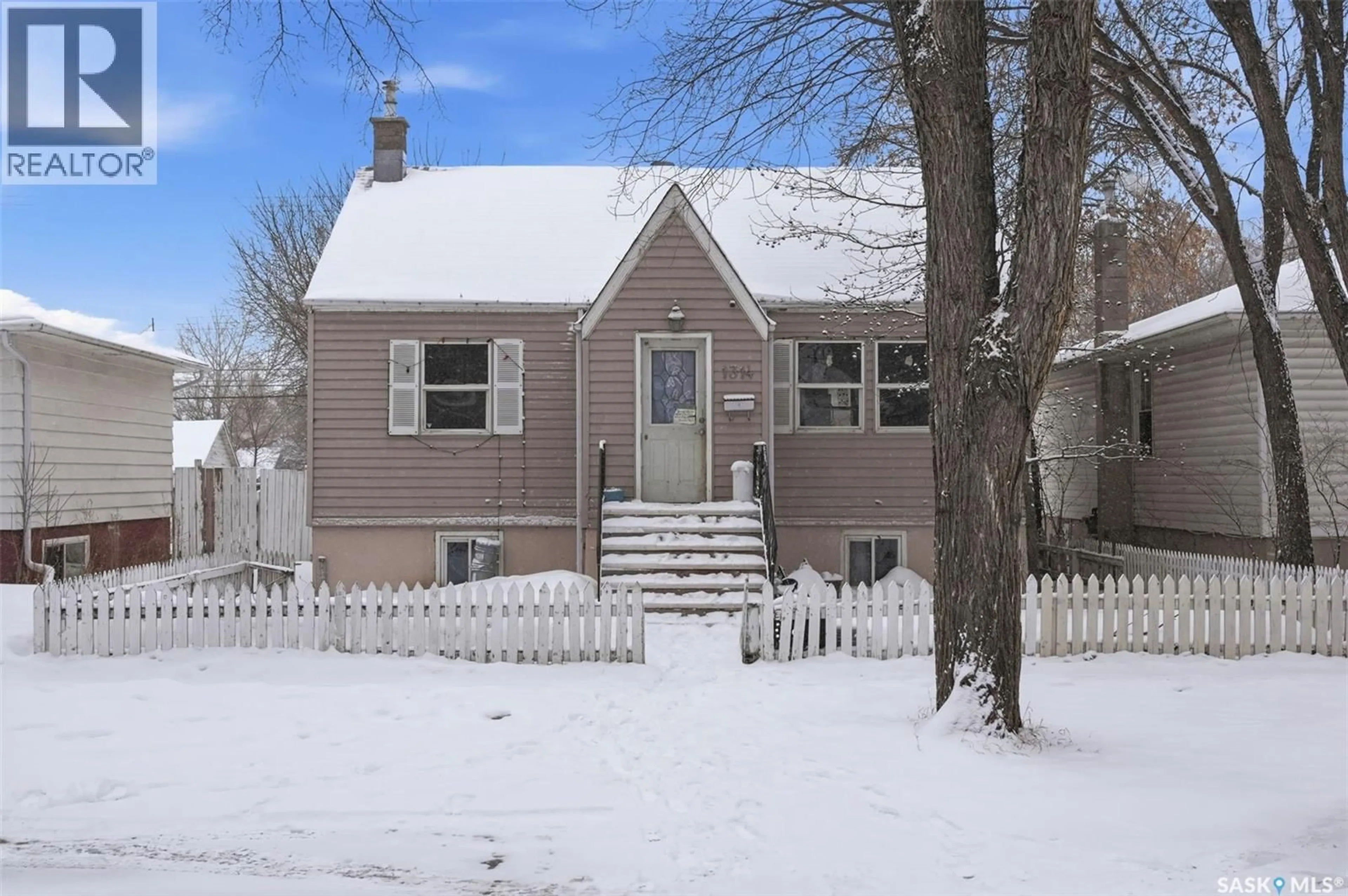 Home with vinyl exterior material, street for 1314 B AVENUE, Saskatoon Saskatchewan S7L1G5