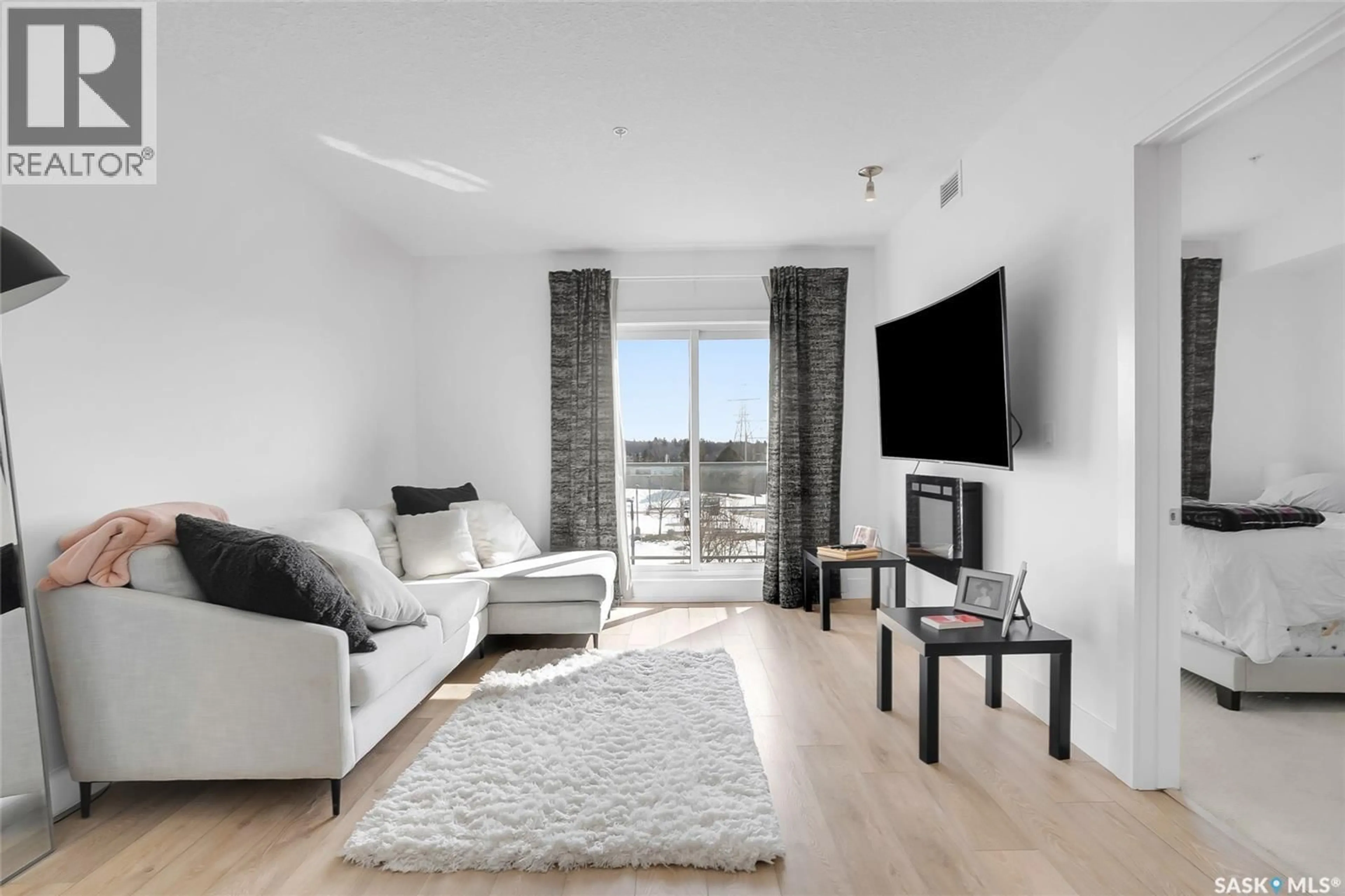 Living room with furniture, unknown for 206 - 404 C AVENUE S, Saskatoon Saskatchewan S7M5M9