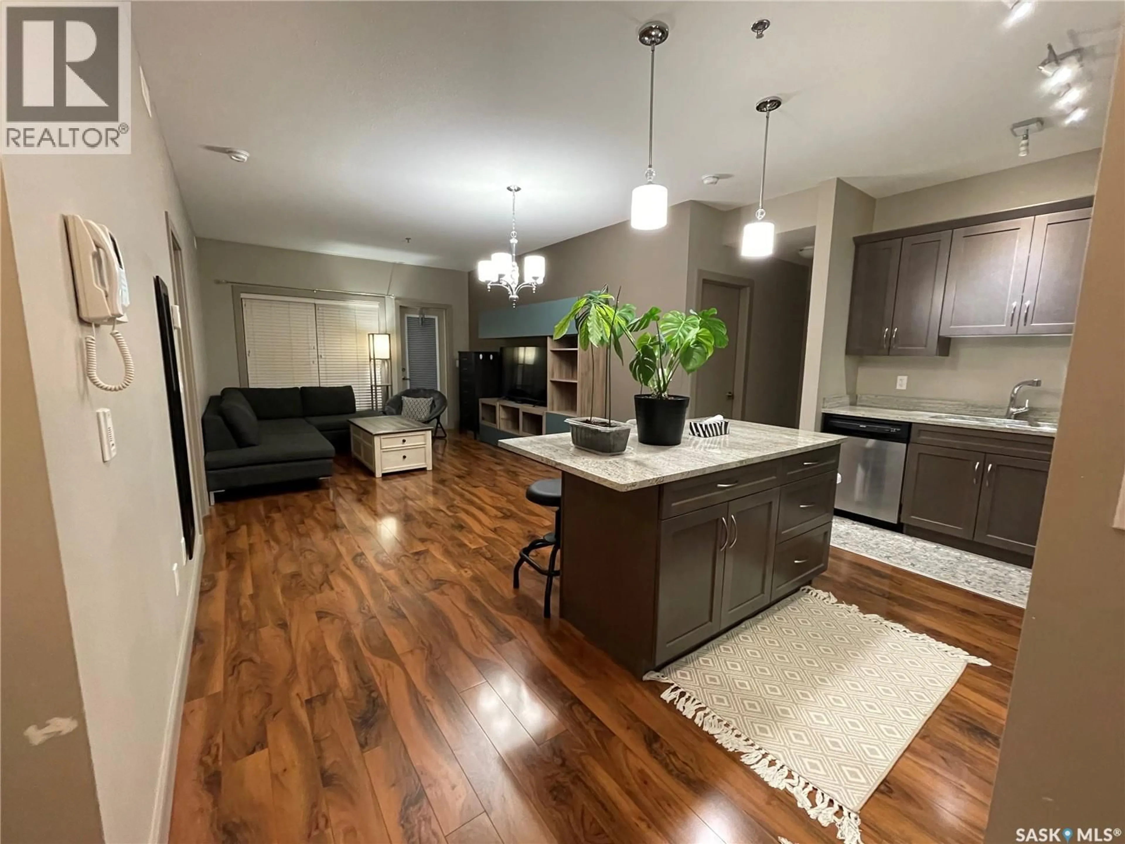 Open concept kitchen, wood/laminate floor for 115 - 211 WILLOWGROVE CRESCENT, Saskatoon Saskatchewan S7H0M3