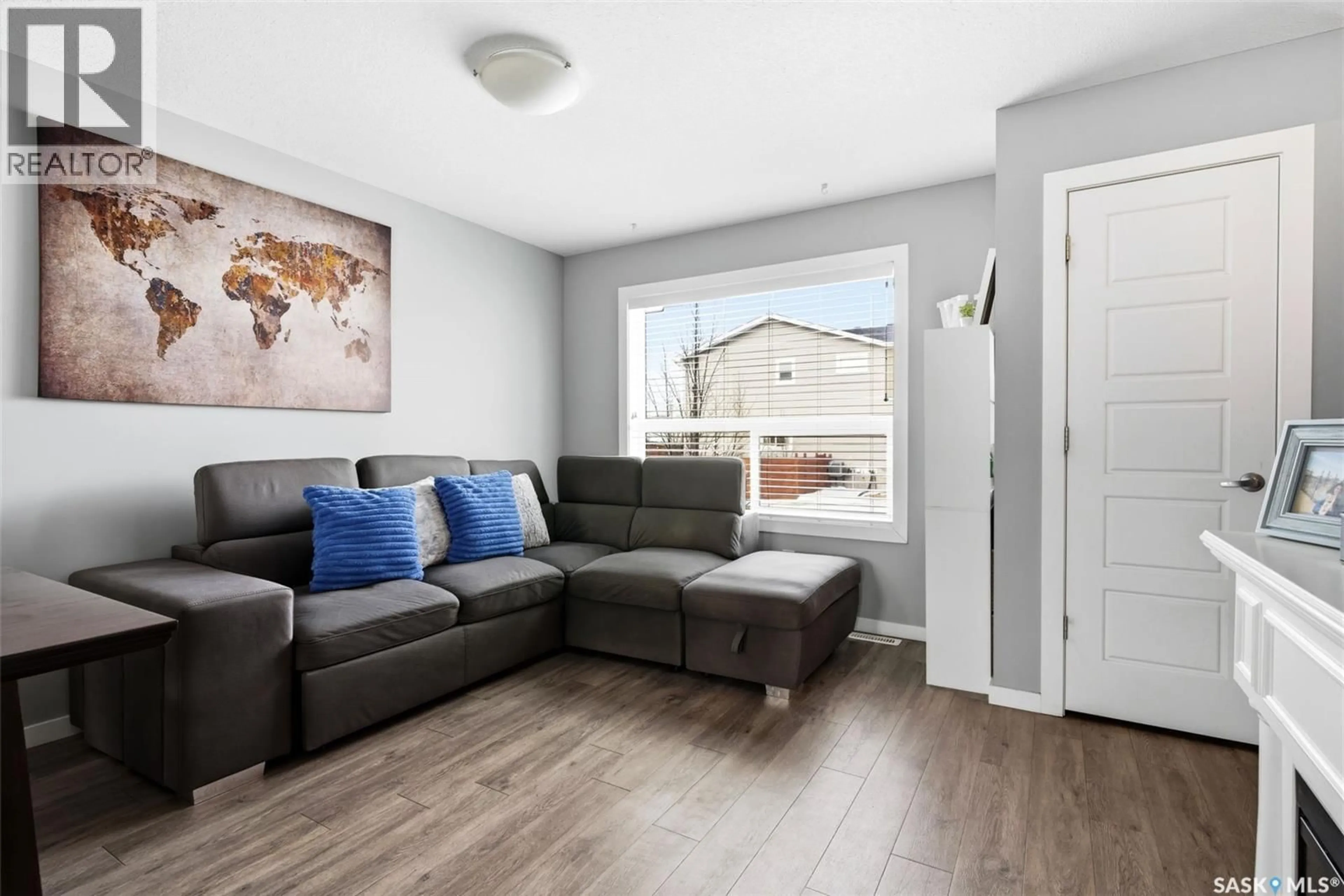 Living room with furniture, wood/laminate floor for 3457 GREEN LAVENDER DRIVE, Regina Saskatchewan S4V3M6