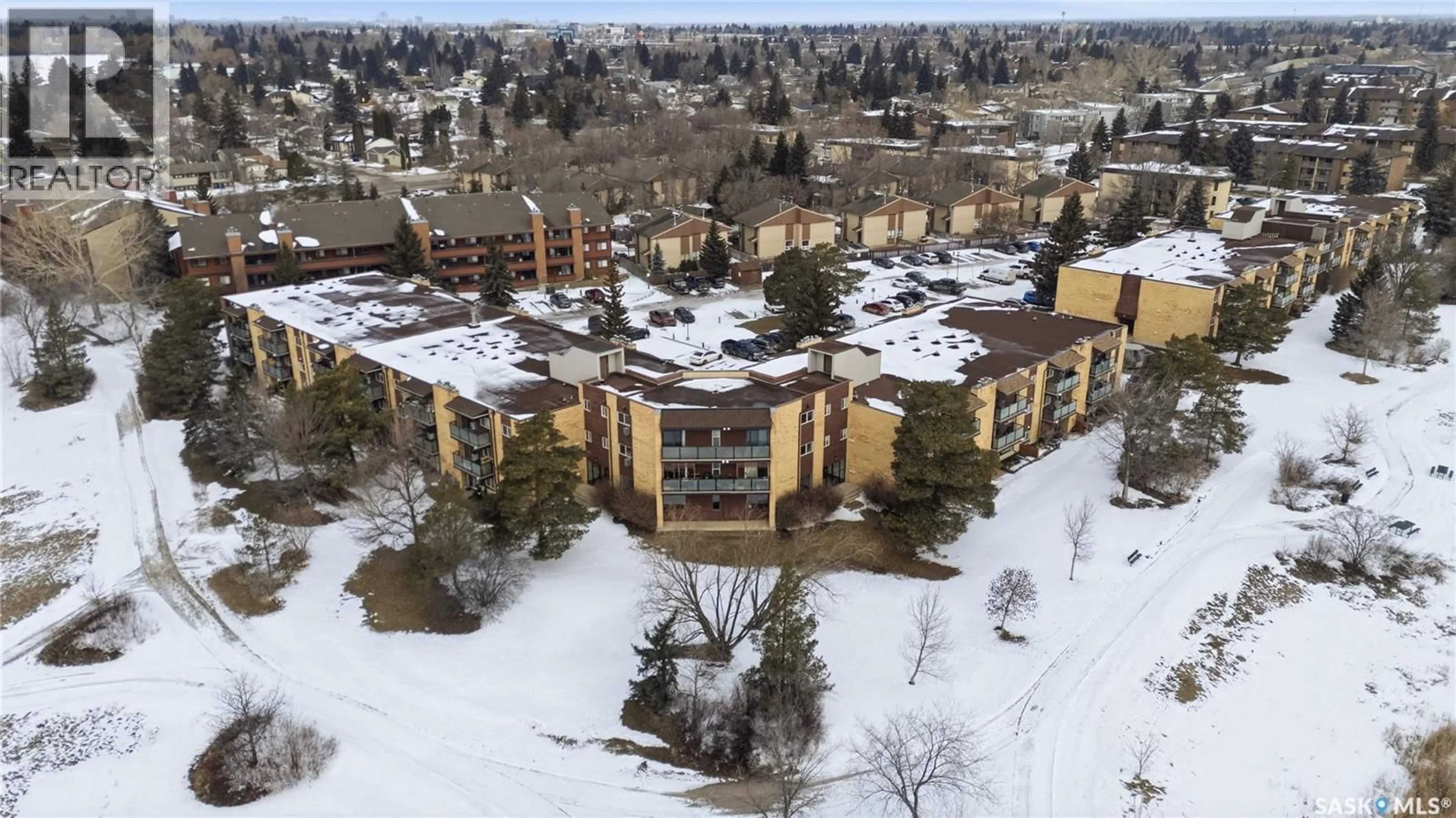 A pic from outside/outdoor area/front of a property/back of a property/a pic from drone, mountain view for 205 - 423 TAIT COURT, Saskatoon Saskatchewan S7H5L3