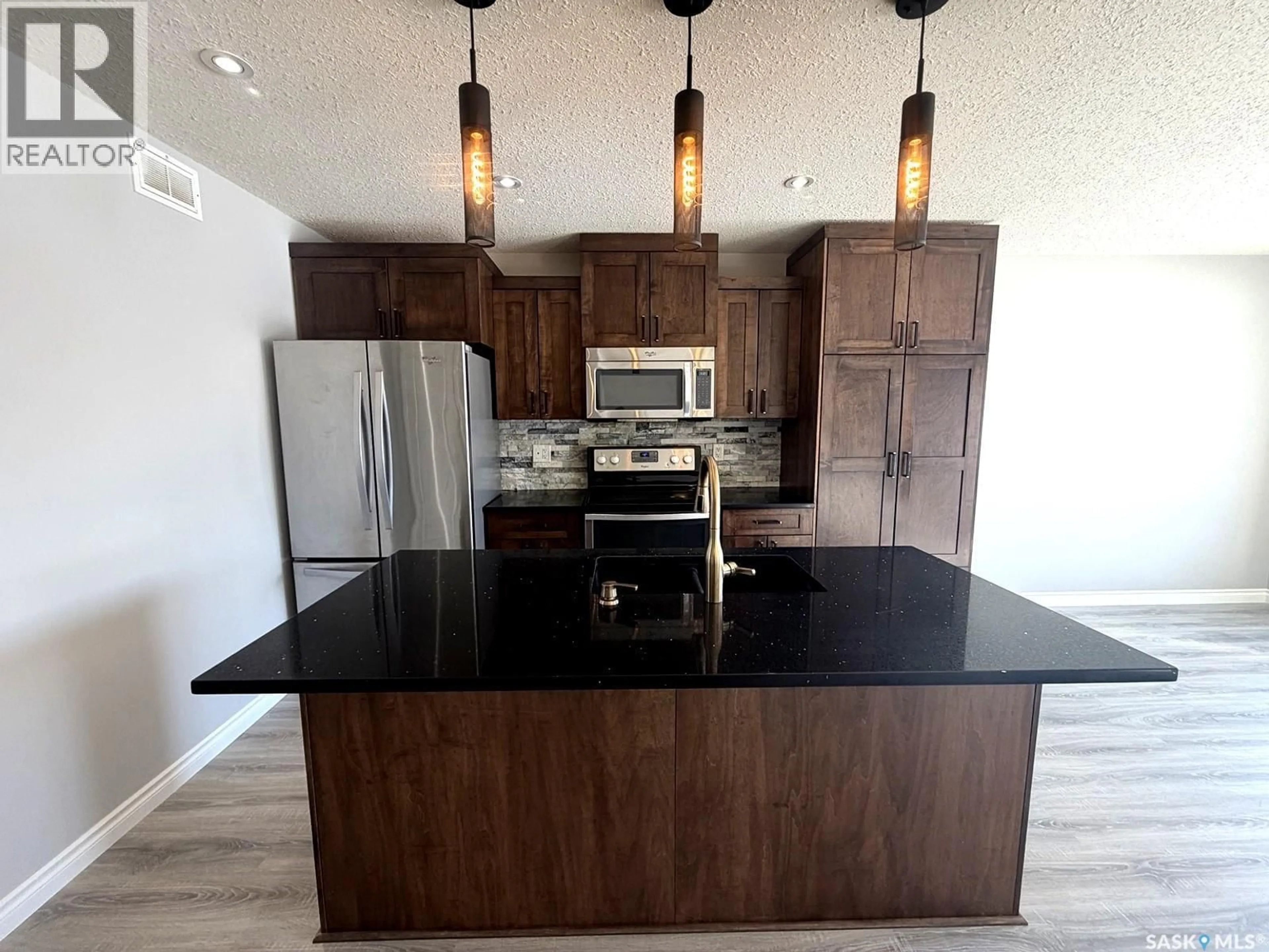 Open concept kitchen, unknown for 103 PLAINS CIRCLE, Pilot Butte Saskatchewan S0G3Z0