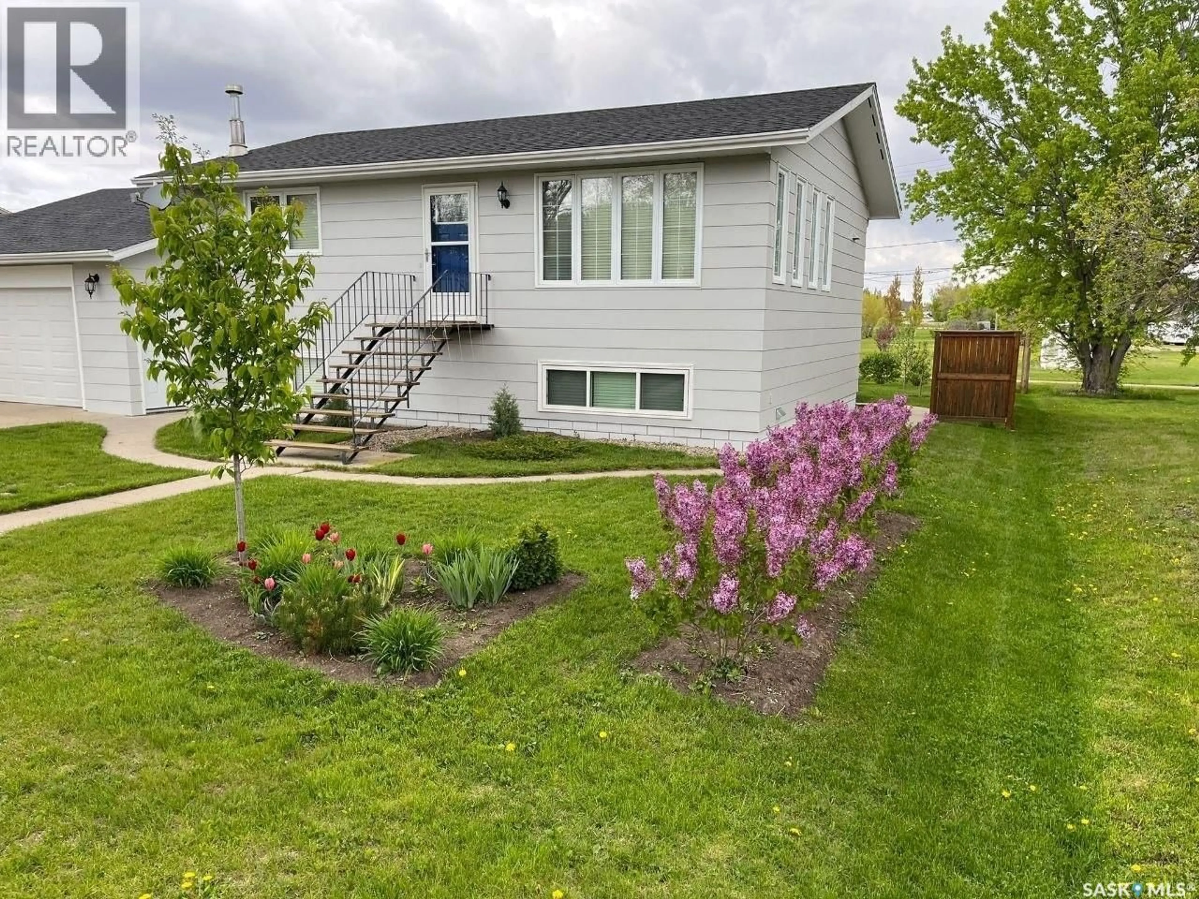 Home with vinyl exterior material, street for 219 CEDAR CRESCENT, Caronport Saskatchewan S0H0S0