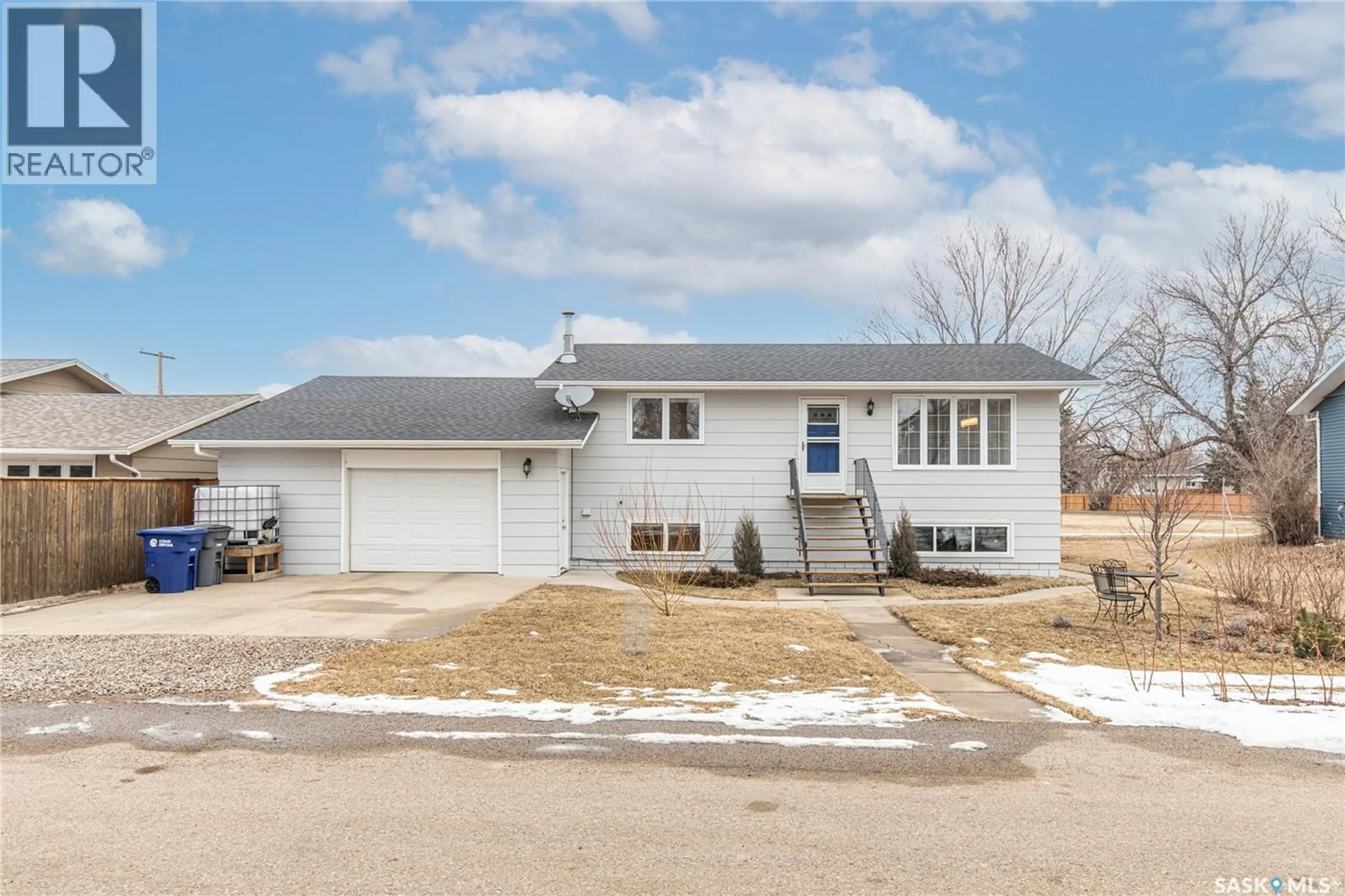 Home with vinyl exterior material, street for 219 CEDAR CRESCENT, Caronport Saskatchewan S0H0S0