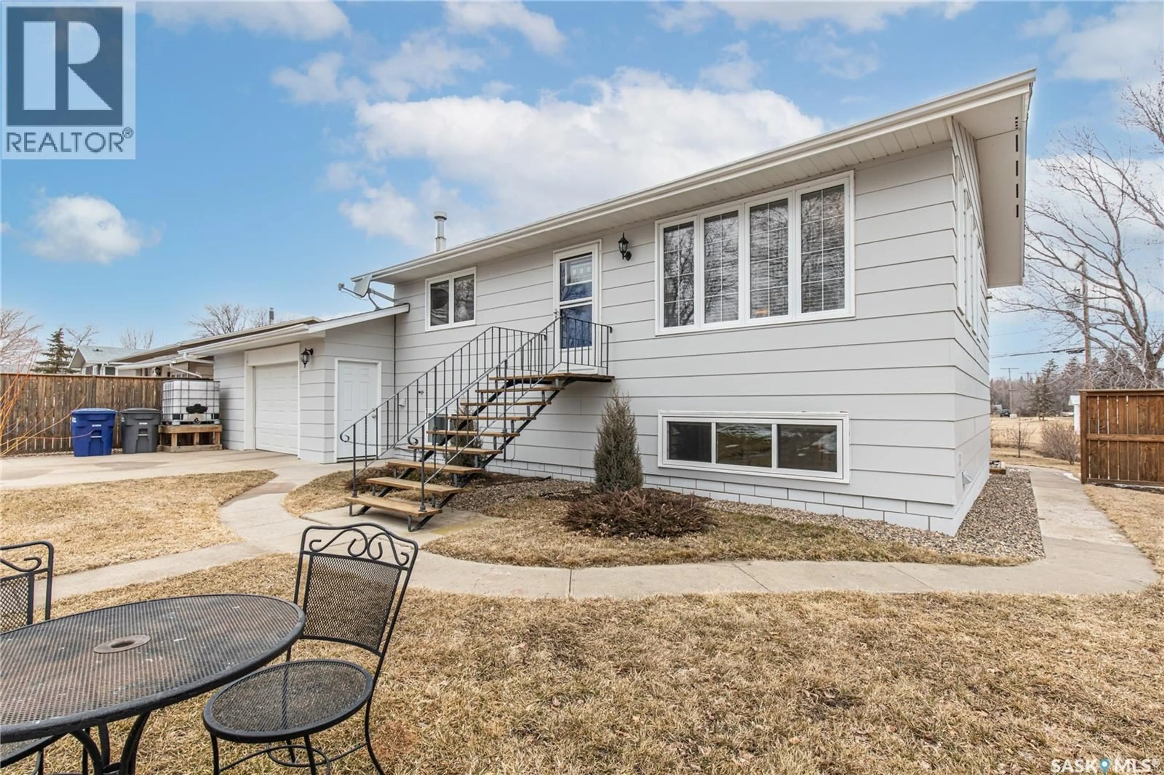 Home with vinyl exterior material, street for 219 CEDAR CRESCENT, Caronport Saskatchewan S0H0S0