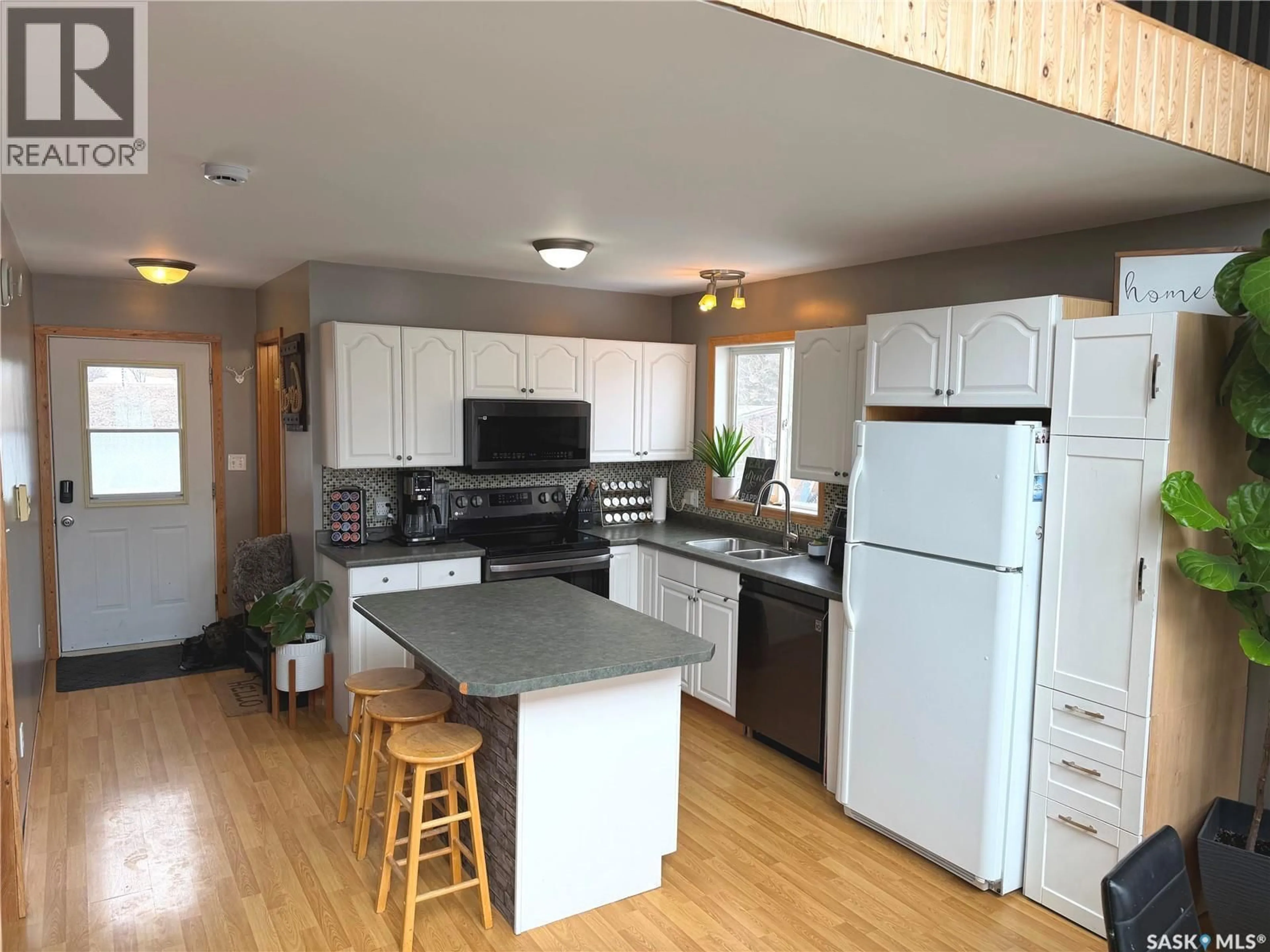 Open concept kitchen, wood/laminate floor for 52 56 HIGHWAY, North Qu'Appelle Rm No. 187 Saskatchewan S0G1S0