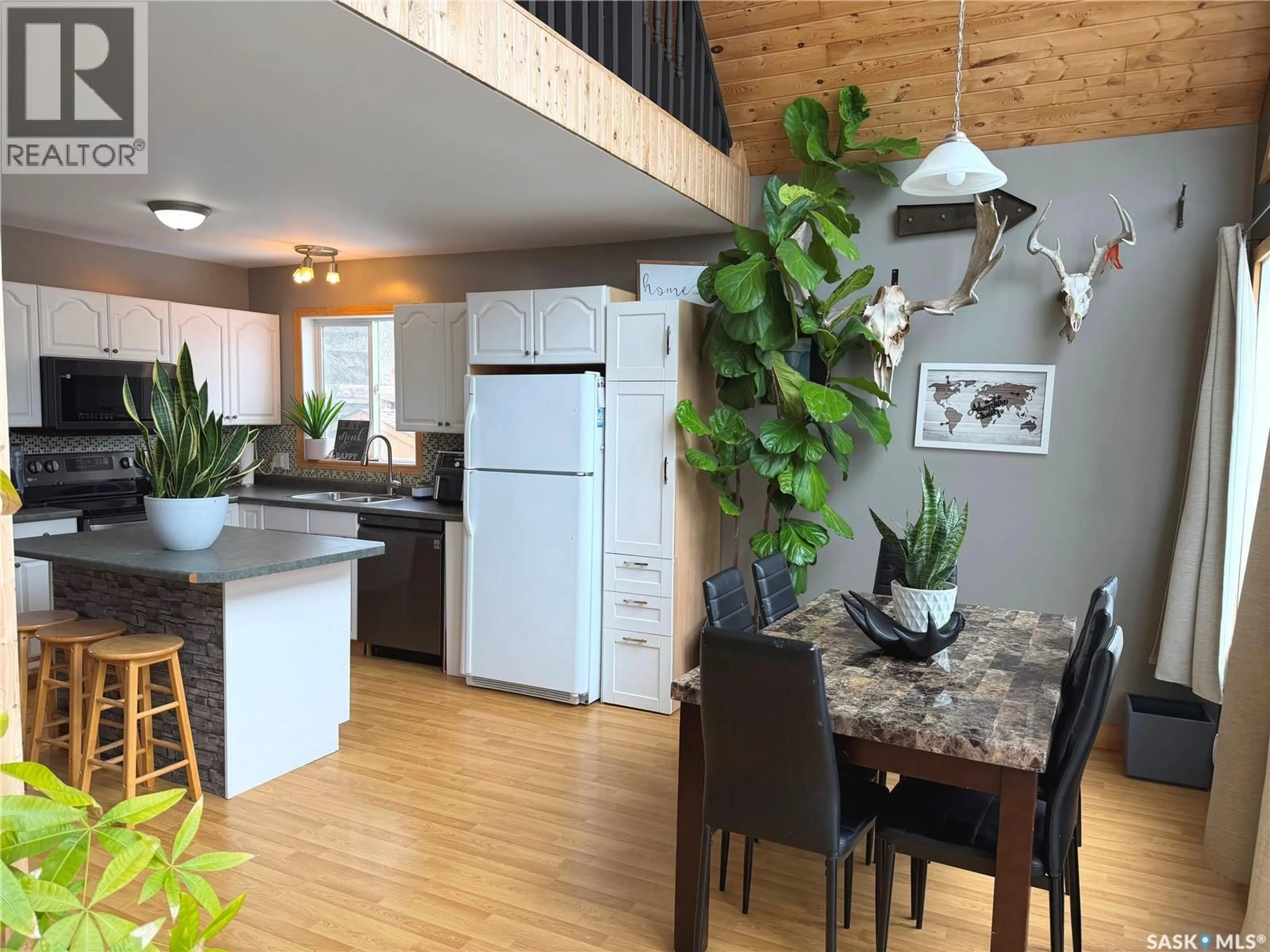 Open concept kitchen, wood/laminate floor for 52 56 HIGHWAY, North Qu'Appelle Rm No. 187 Saskatchewan S0G1S0