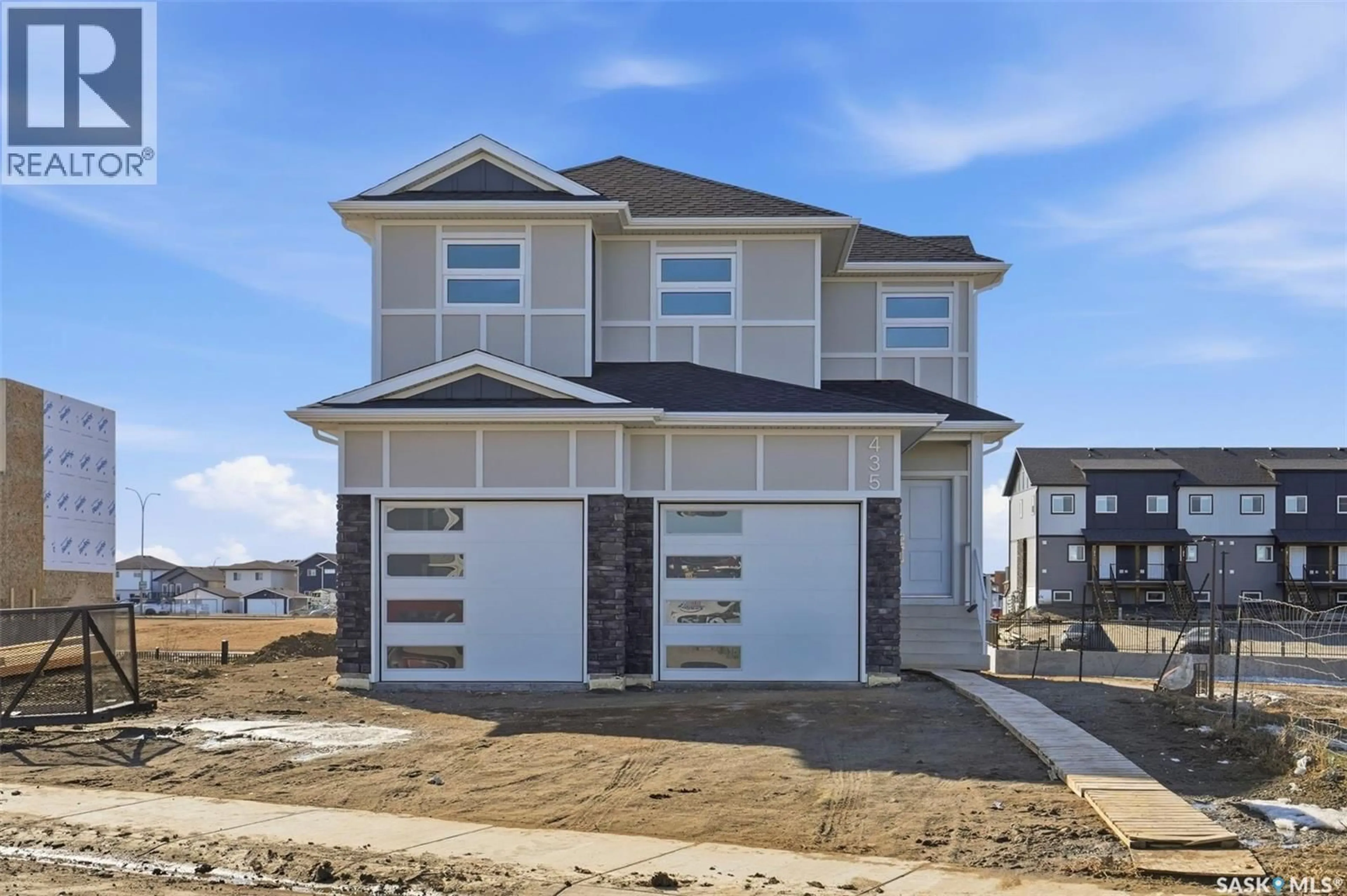 Home with vinyl exterior material, street for 435 SHARMA CRESCENT, Saskatoon Saskatchewan S7W0Y4