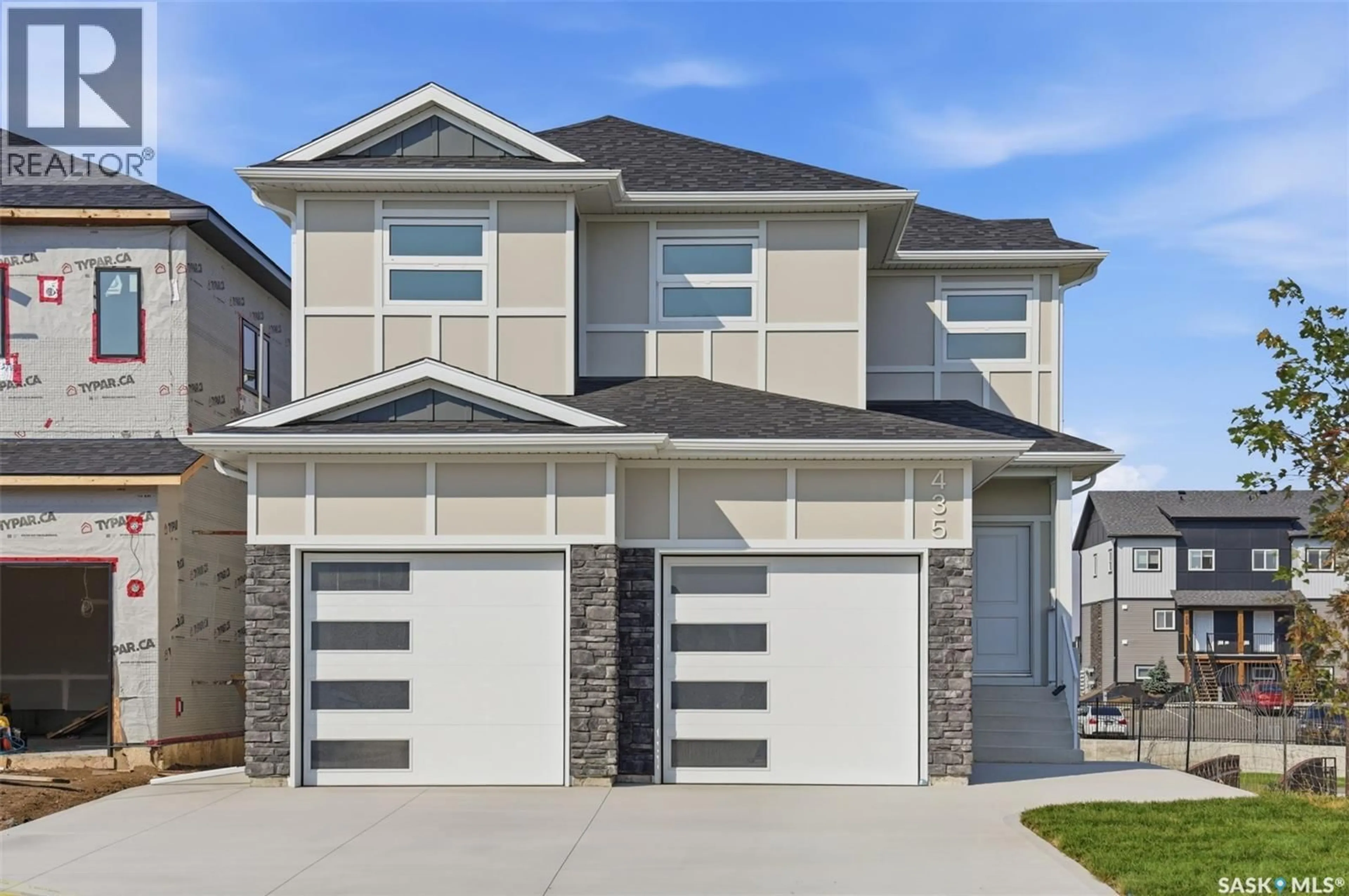 Home with vinyl exterior material, street for 435 SHARMA CRESCENT, Saskatoon Saskatchewan S7W0Y4