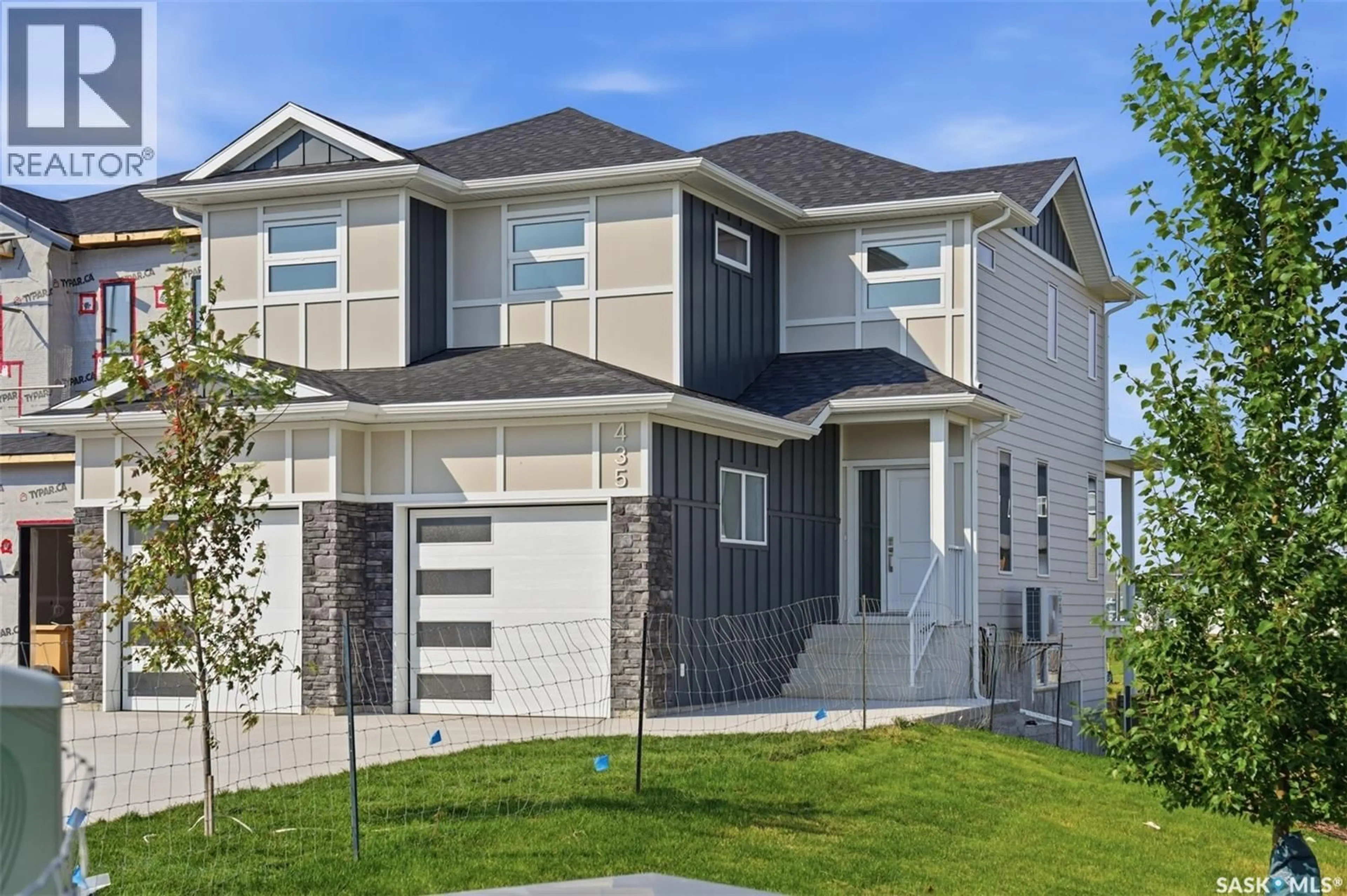 Home with vinyl exterior material, street for 435 SHARMA CRESCENT, Saskatoon Saskatchewan S7W0Y4