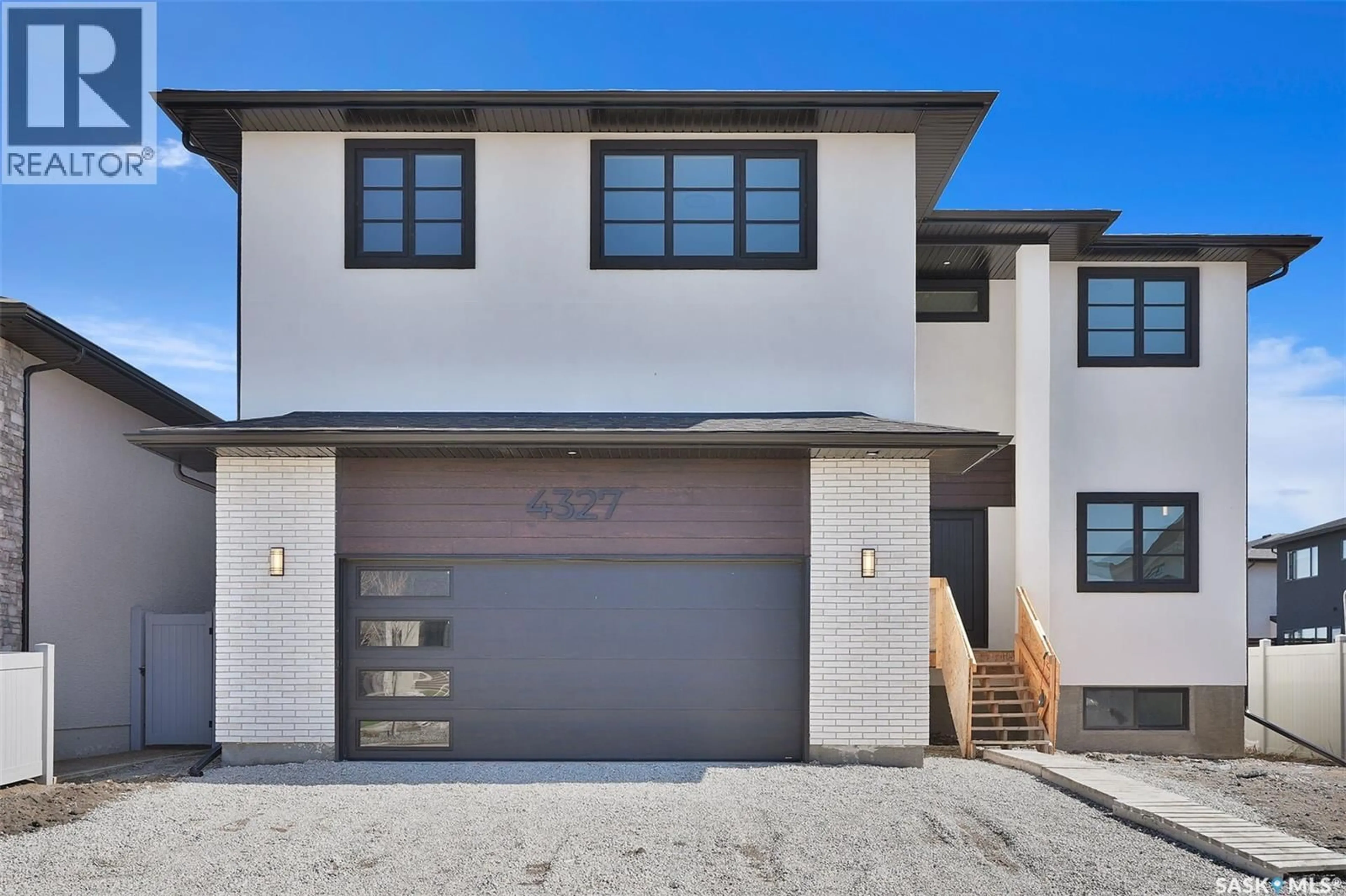 Home with brick exterior material, street for 4327 WILD ROSE DRIVE, Regina Saskatchewan S4V3V6