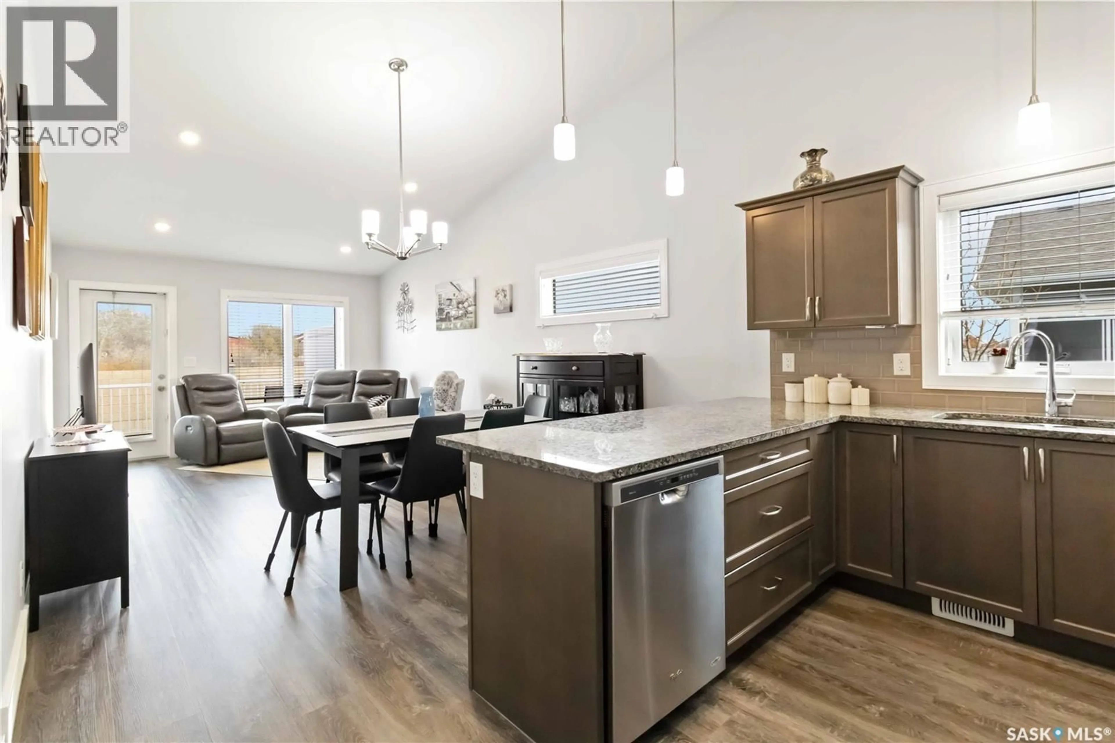 Open concept kitchen, wood/laminate floor for 14 3214 11TH STREET, Saskatoon Saskatchewan S7M5G3