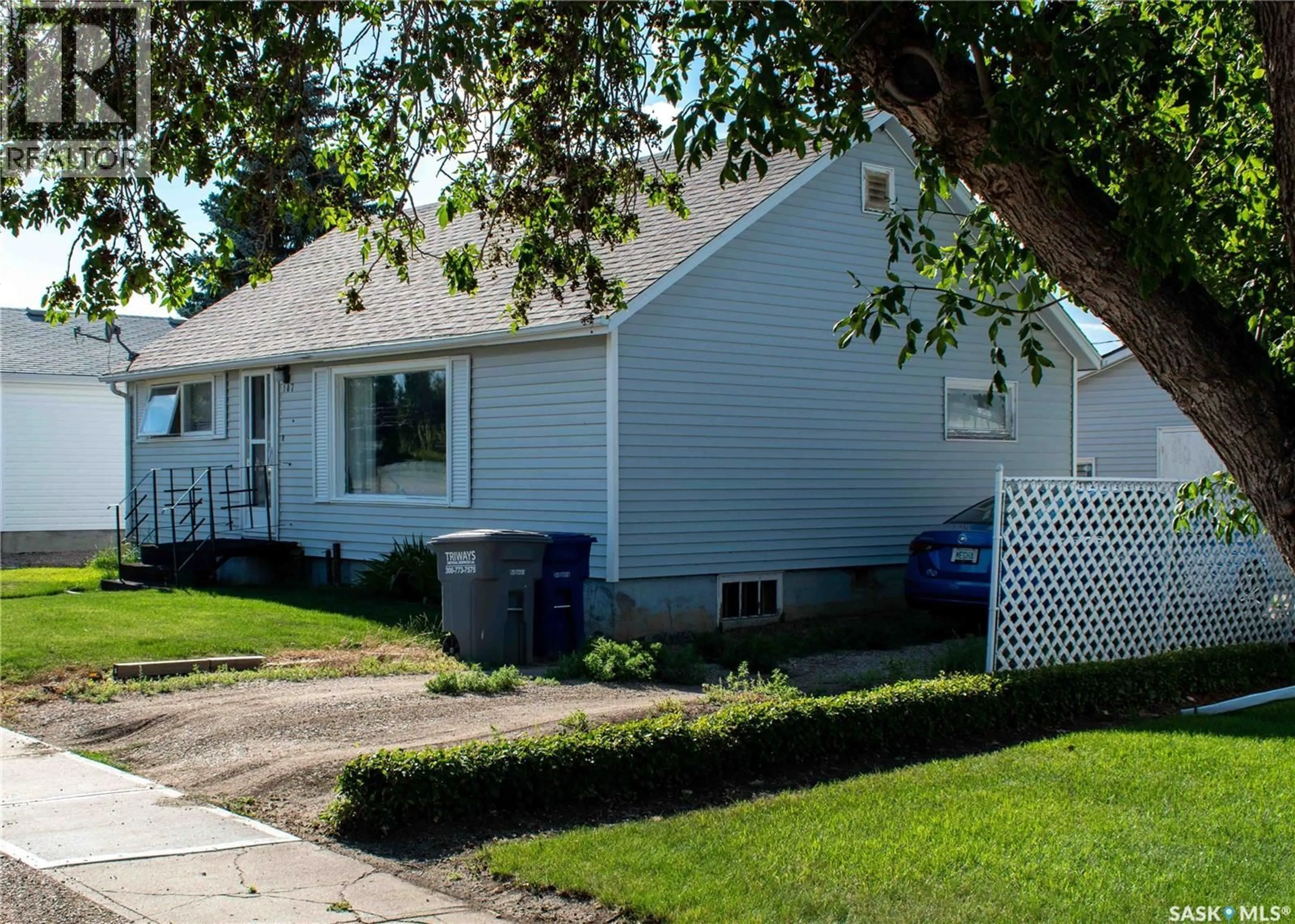 Home with vinyl exterior material, street for 107 3RD AVENUE, Elrose Saskatchewan S0L0Z0
