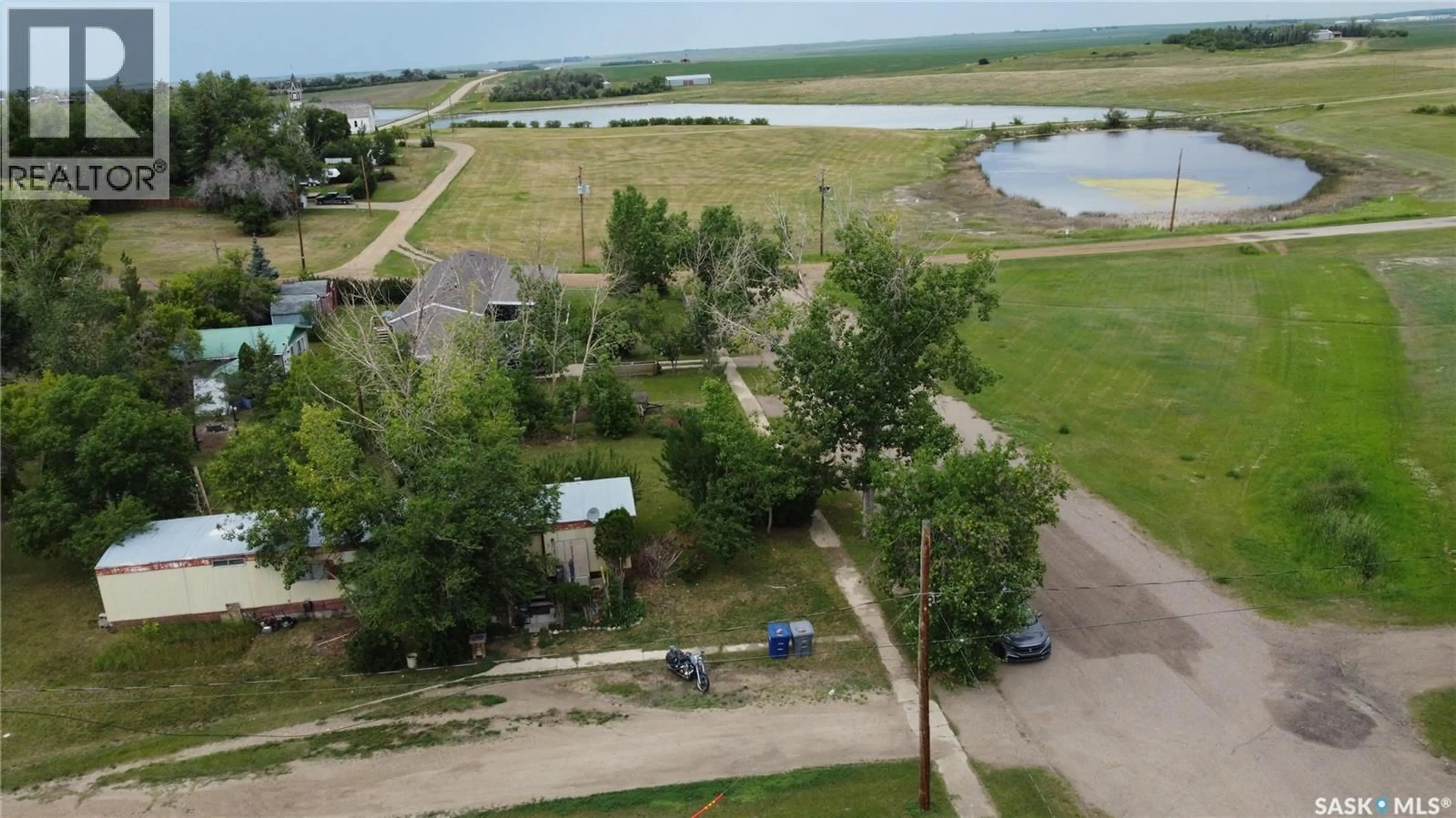A pic from outside/outdoor area/front of a property/back of a property/a pic from drone, water/lake/river/ocean view for 316 KLASSEN STREET, Herbert Saskatchewan S0H2A0