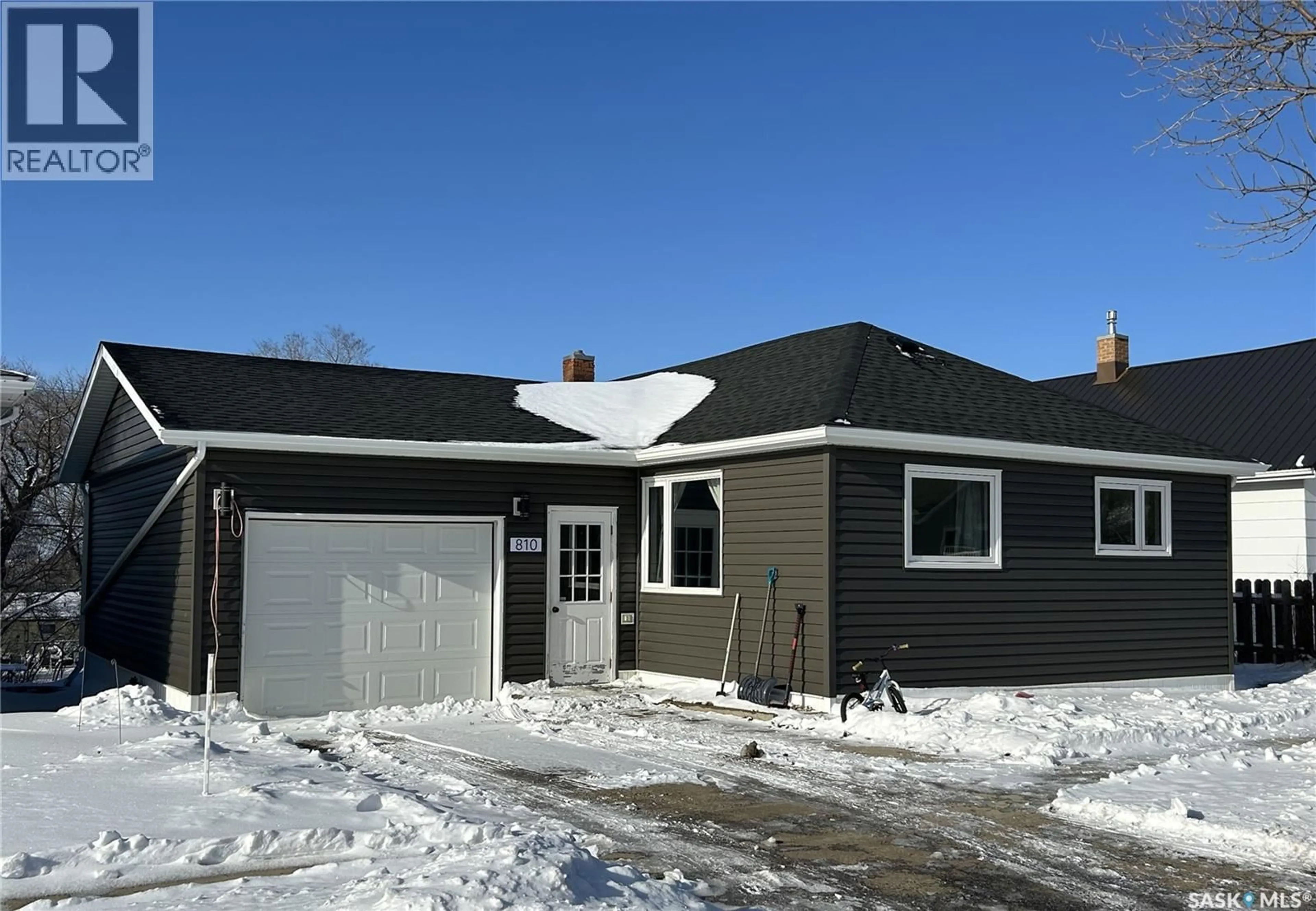 Home with vinyl exterior material, street for 810 2ND STREET, Estevan Saskatchewan S4A0L2