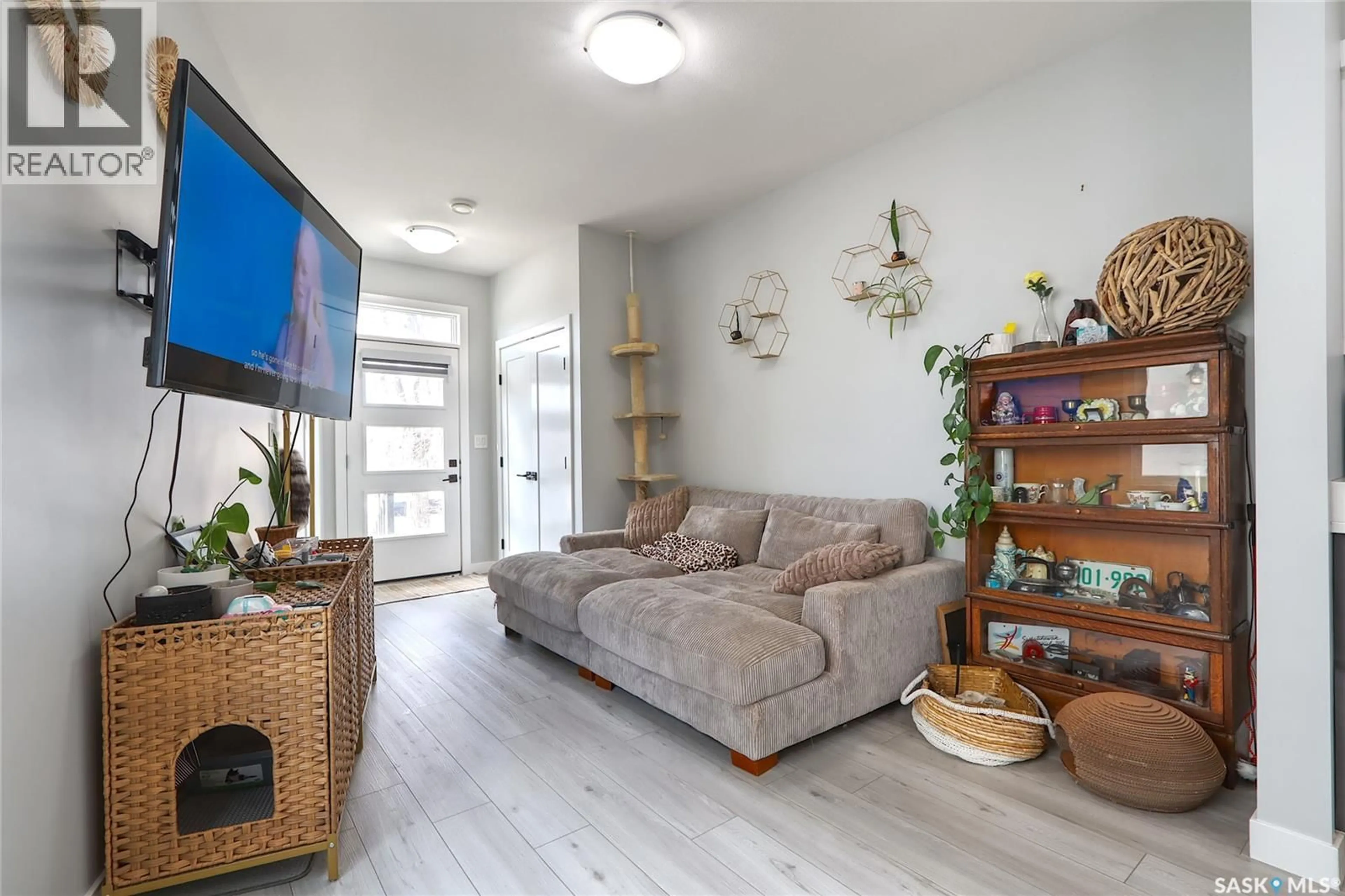 Living room with furniture, wood/laminate floor for 2213 PASQUA STREET, Regina Saskatchewan S4T4M5