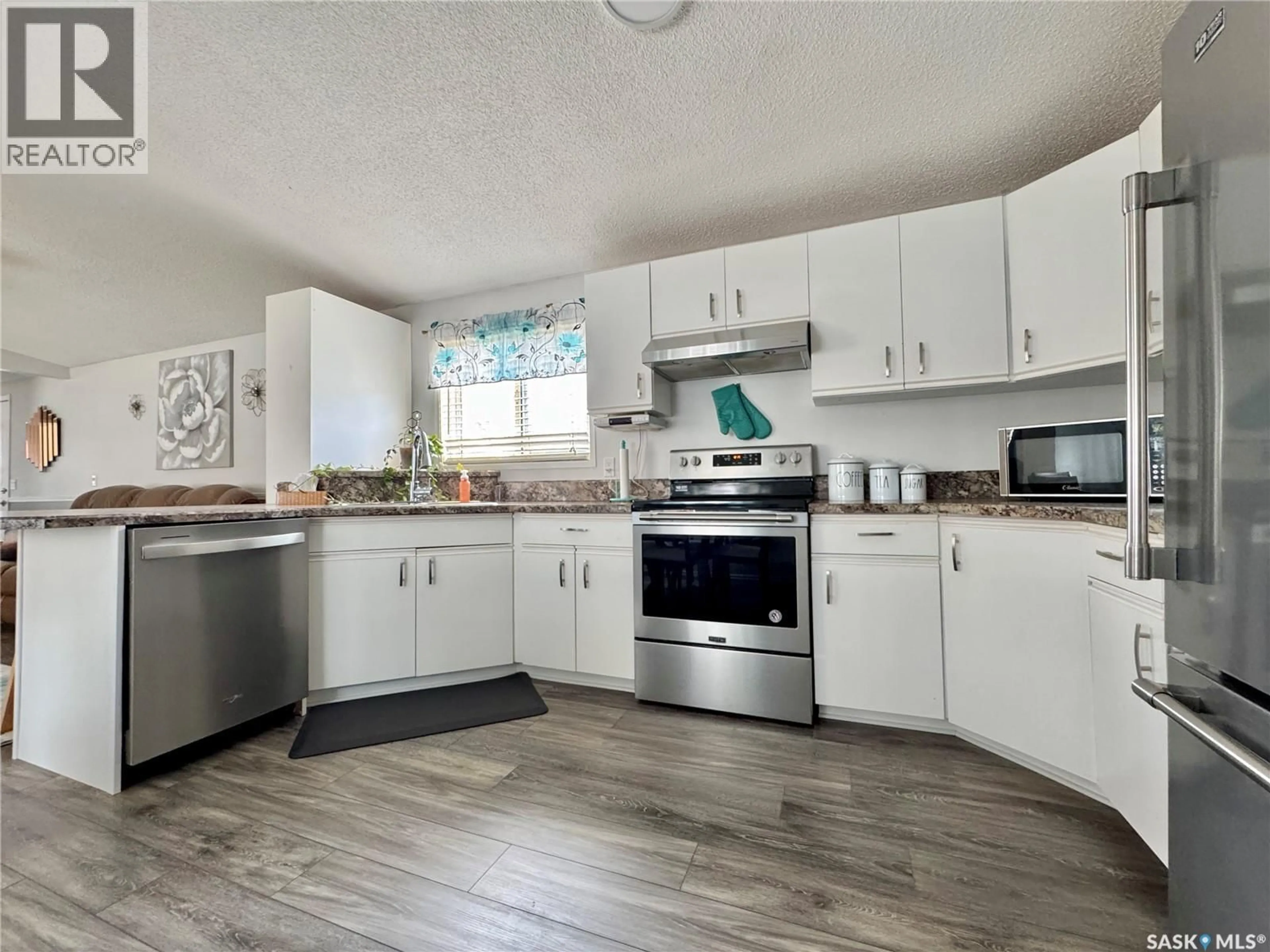 Open concept kitchen, unknown for E - 317 RIEDEL AVENUE, Langenburg Saskatchewan S0A2A0