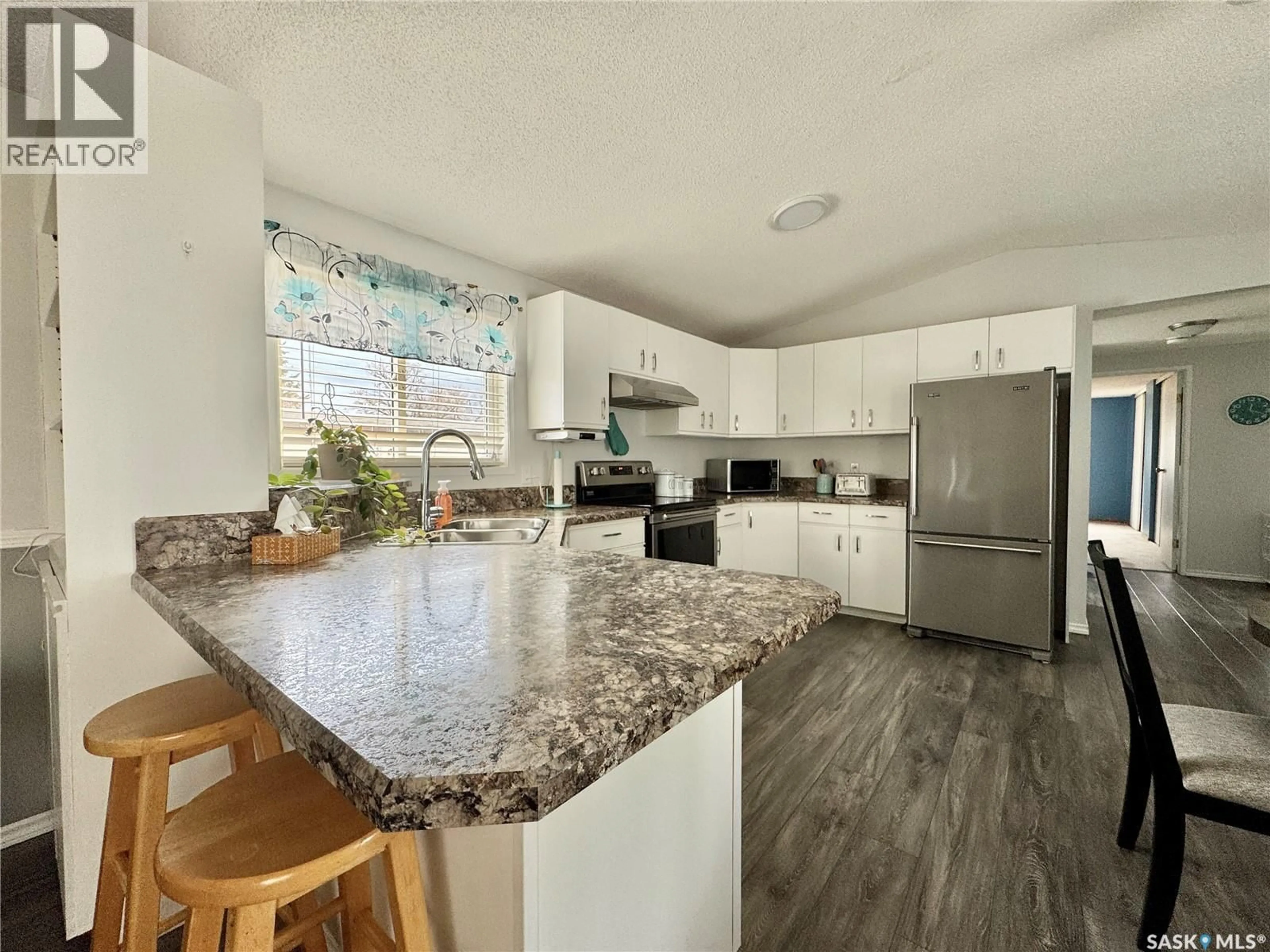 Open concept kitchen, unknown for E - 317 RIEDEL AVENUE, Langenburg Saskatchewan S0A2A0