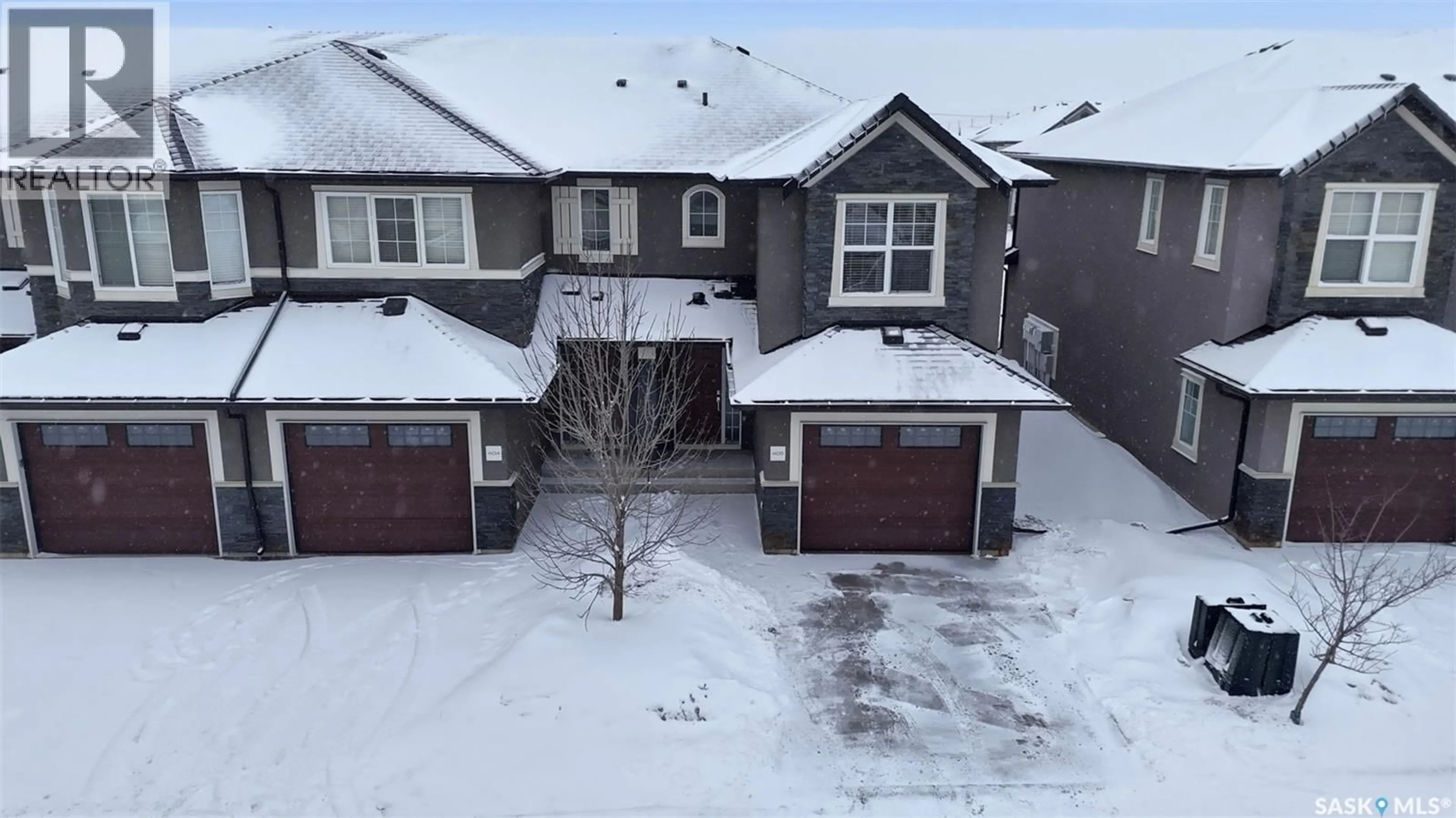 A pic from outside/outdoor area/front of a property/back of a property/a pic from drone, street for 405 - 1303 PATON CRESCENT, Saskatoon Saskatchewan S7W0P6