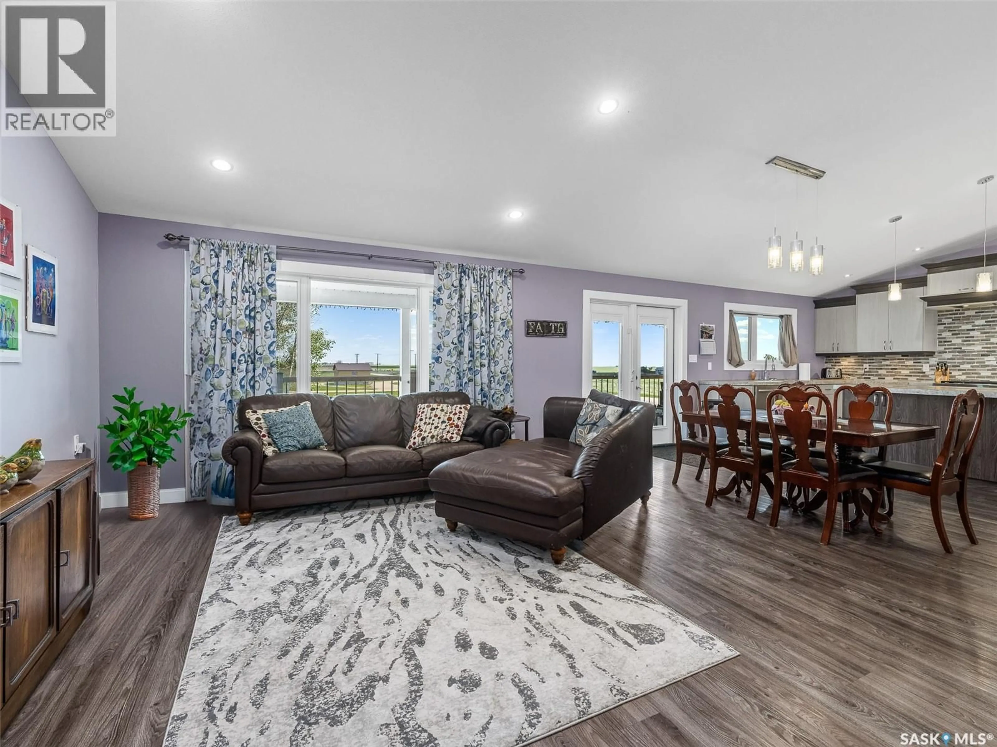 Living room with furniture, wood/laminate floor for 1 BROWNLEE STREET, Tuxford Saskatchewan S0H4C0