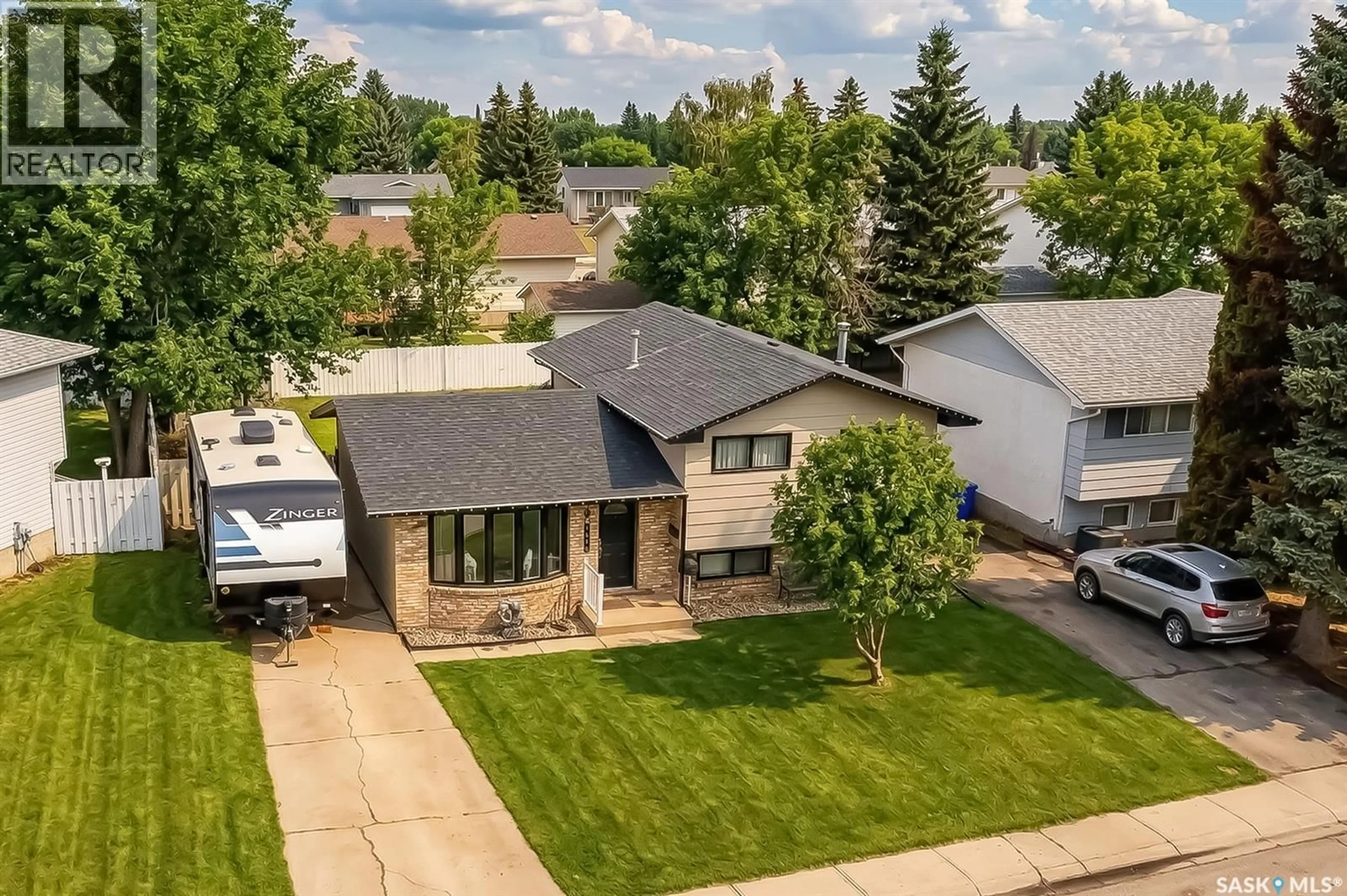 A pic from outside/outdoor area/front of a property/back of a property/a pic from drone, street for 1365 PRINCE CRESCENT, Moose Jaw Saskatchewan S6H6E6