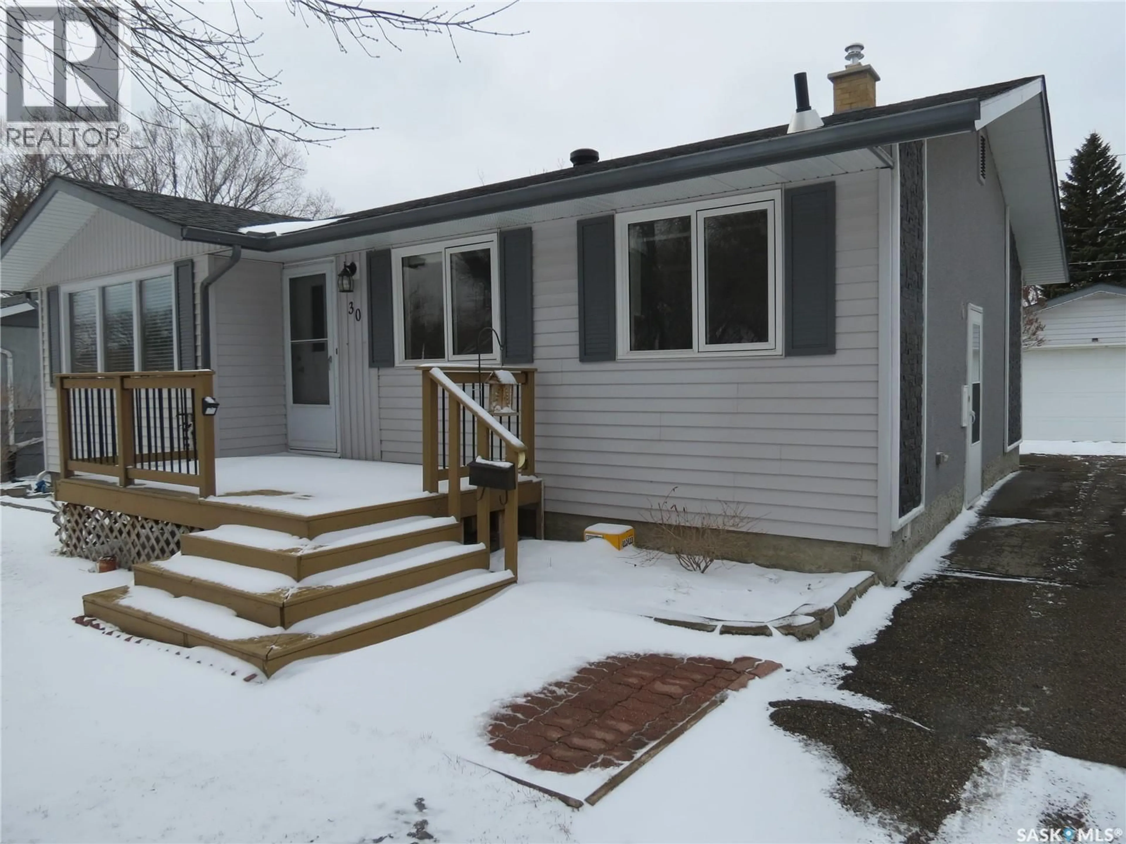 Home with vinyl exterior material, street for 30 CLELAND STREET, Regina Saskatchewan S4R4G2