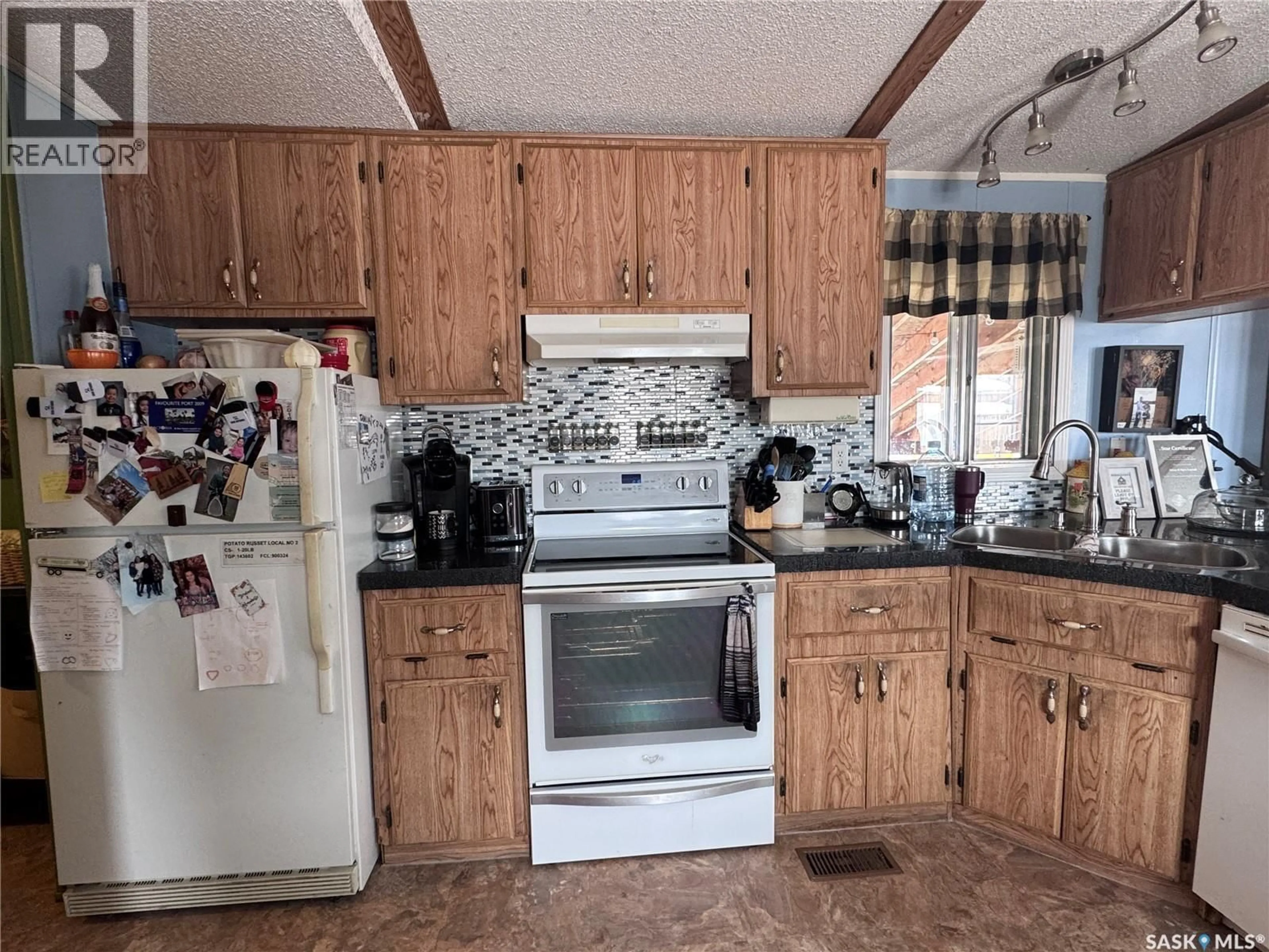 Standard kitchen, ceramic/tile floor for 1111 RIESE DRIVE, La Ronge Saskatchewan S0J1L0
