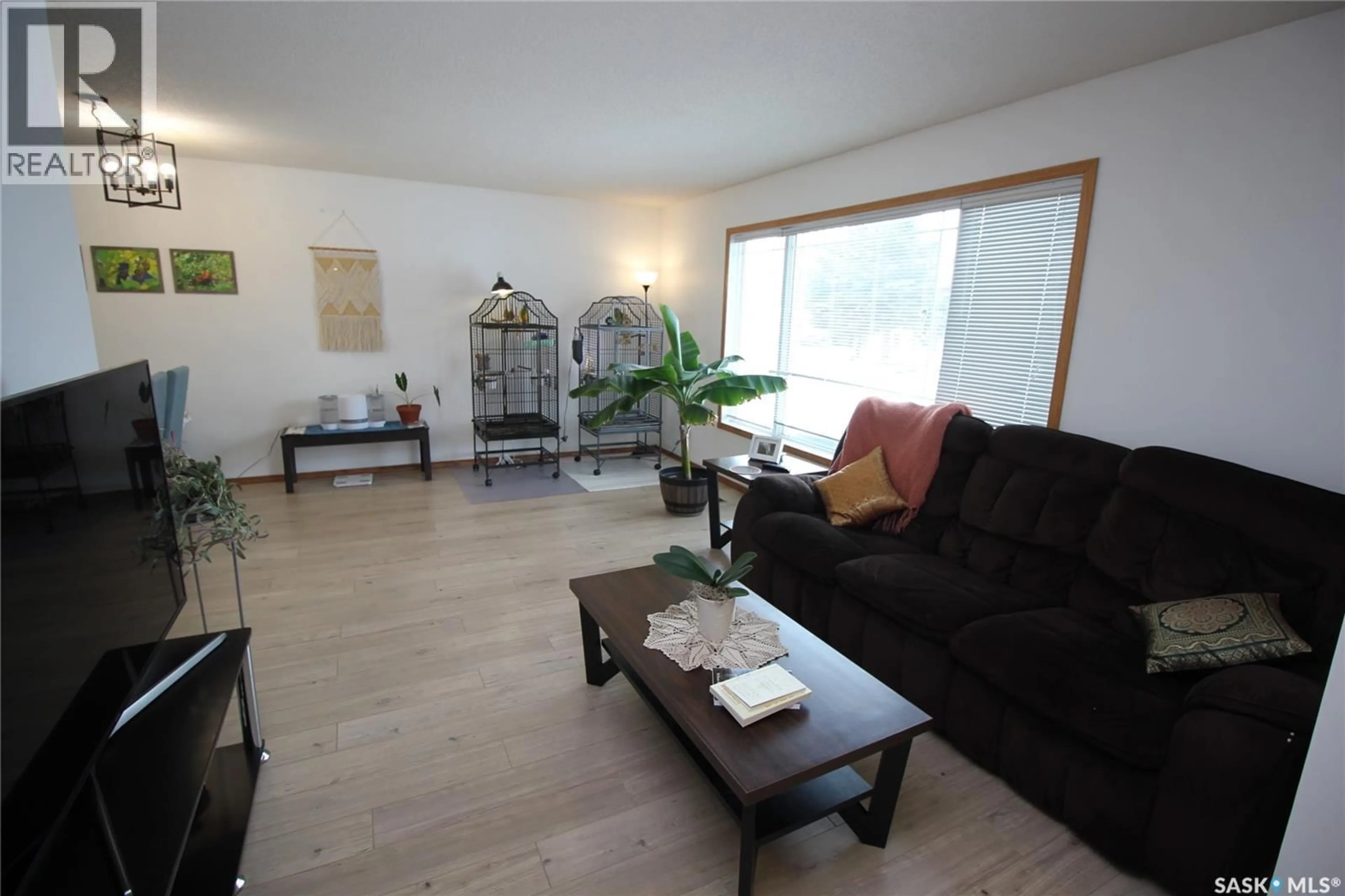 Living room with furniture, wood/laminate floor for 804 PITT STREET, Indian Head Saskatchewan S0G2K0