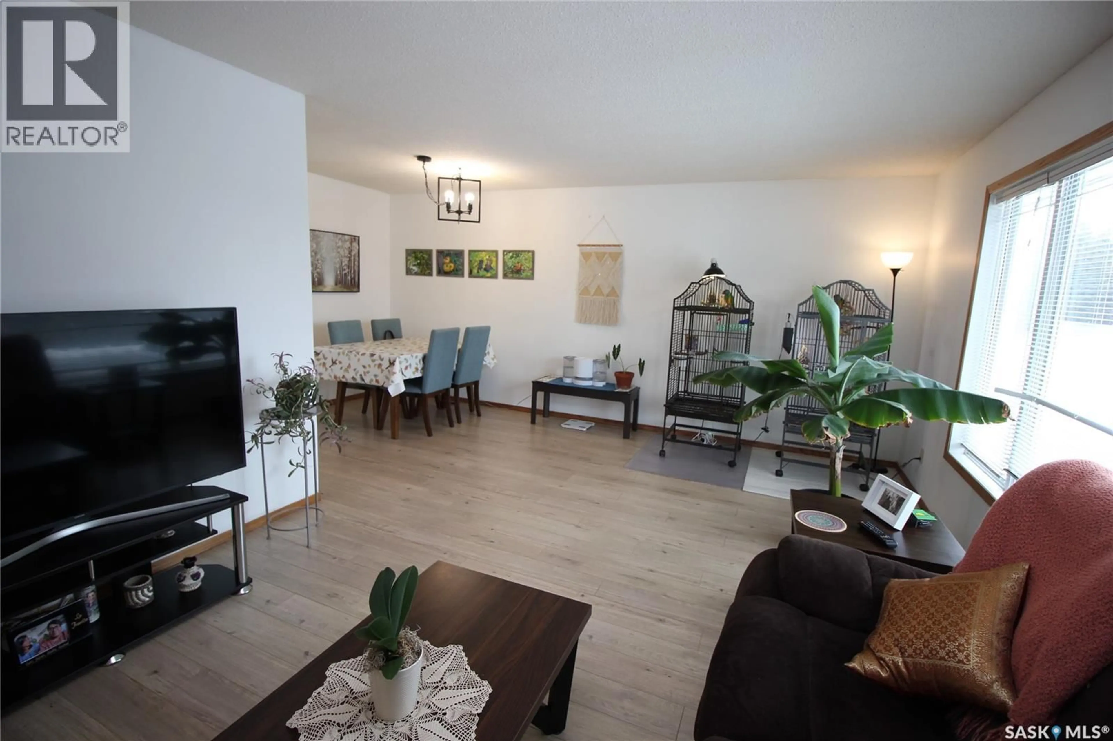 Living room with furniture, wood/laminate floor for 804 PITT STREET, Indian Head Saskatchewan S0G2K0