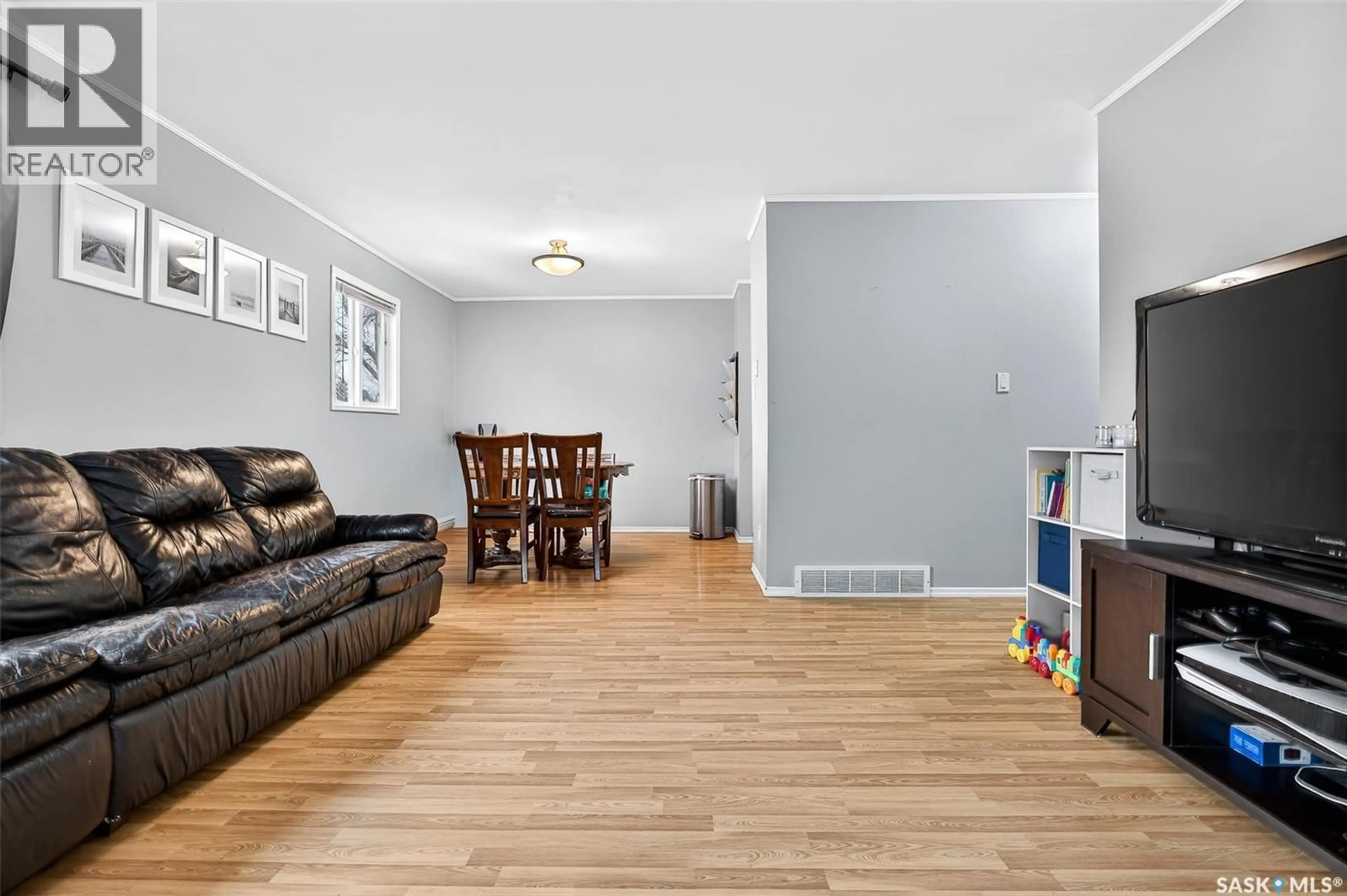 Living room with furniture, wood/laminate floor for 1123 ATHABASCA STREET, Moose Jaw Saskatchewan S6H2E8