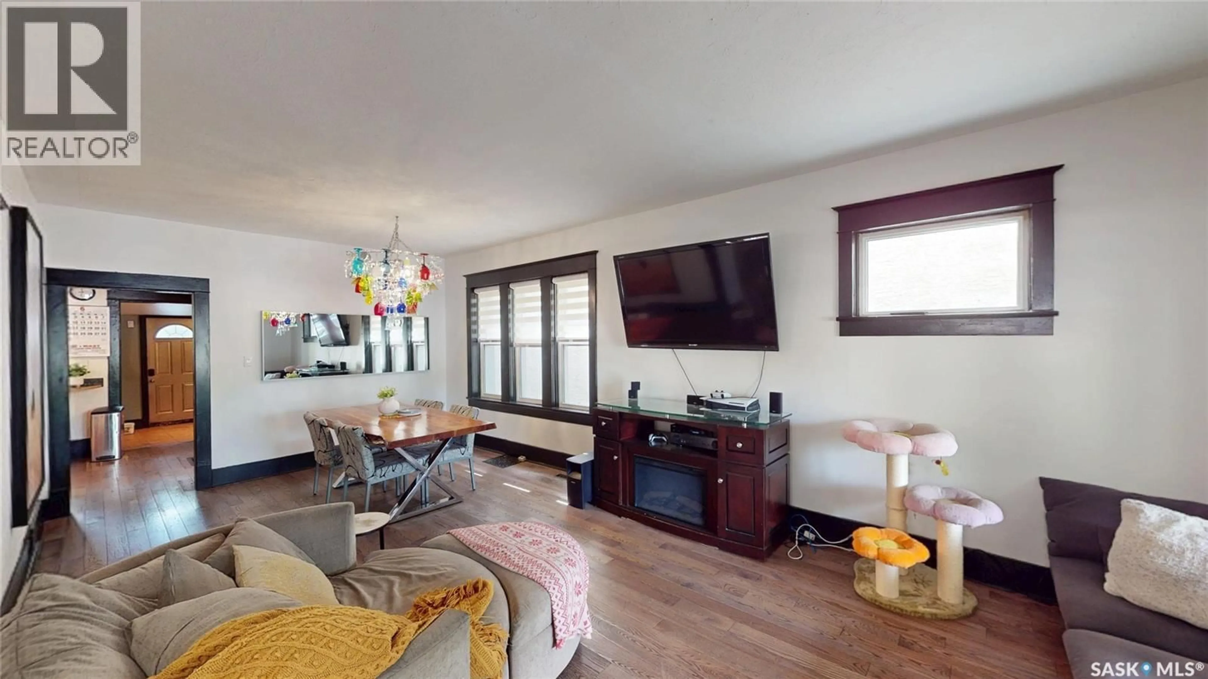 Living room with furniture, wood/laminate floor for 2161 CAMERON STREET, Regina Saskatchewan S4T2V7