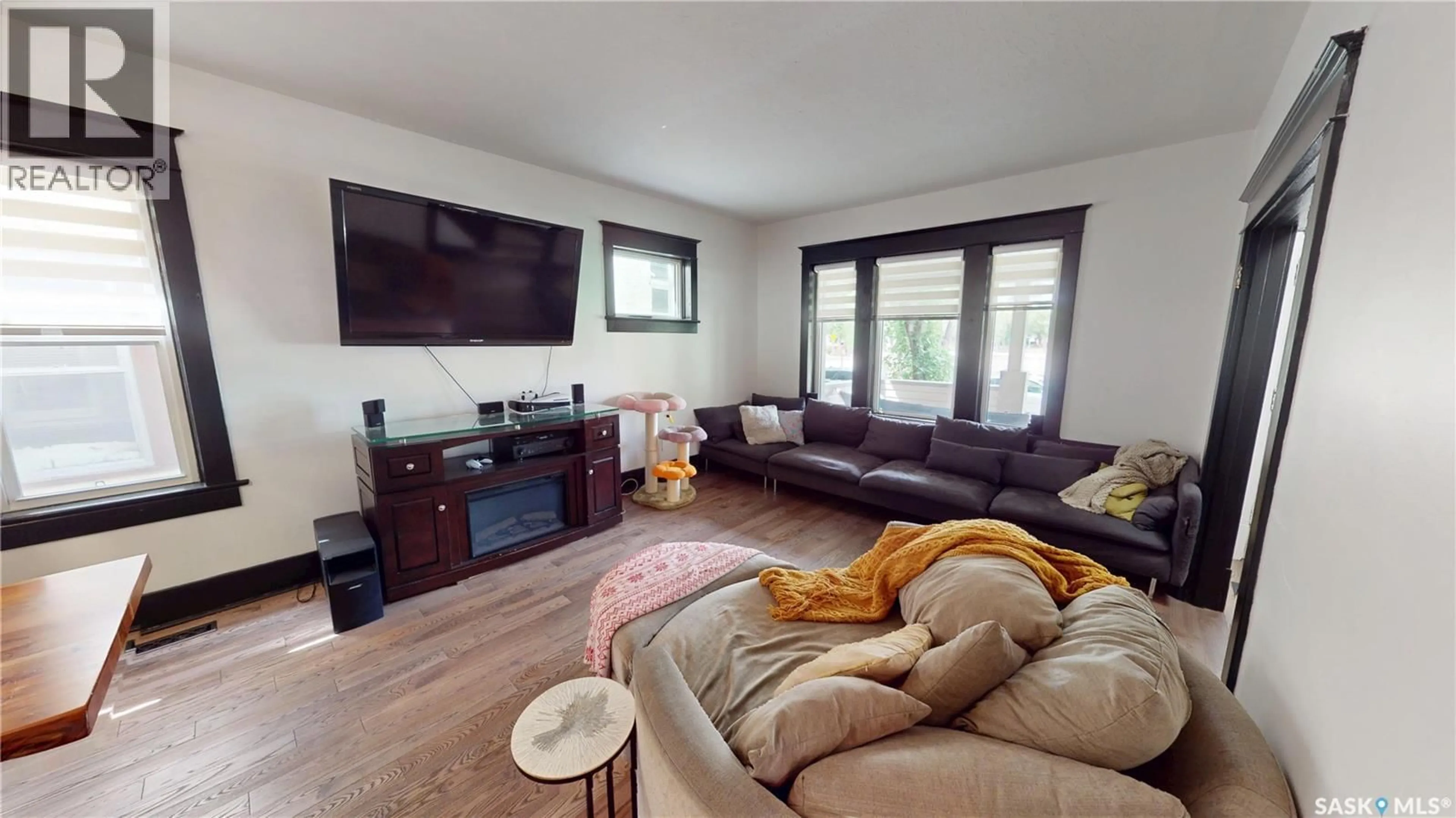 Living room with furniture, wood/laminate floor for 2161 CAMERON STREET, Regina Saskatchewan S4T2V7