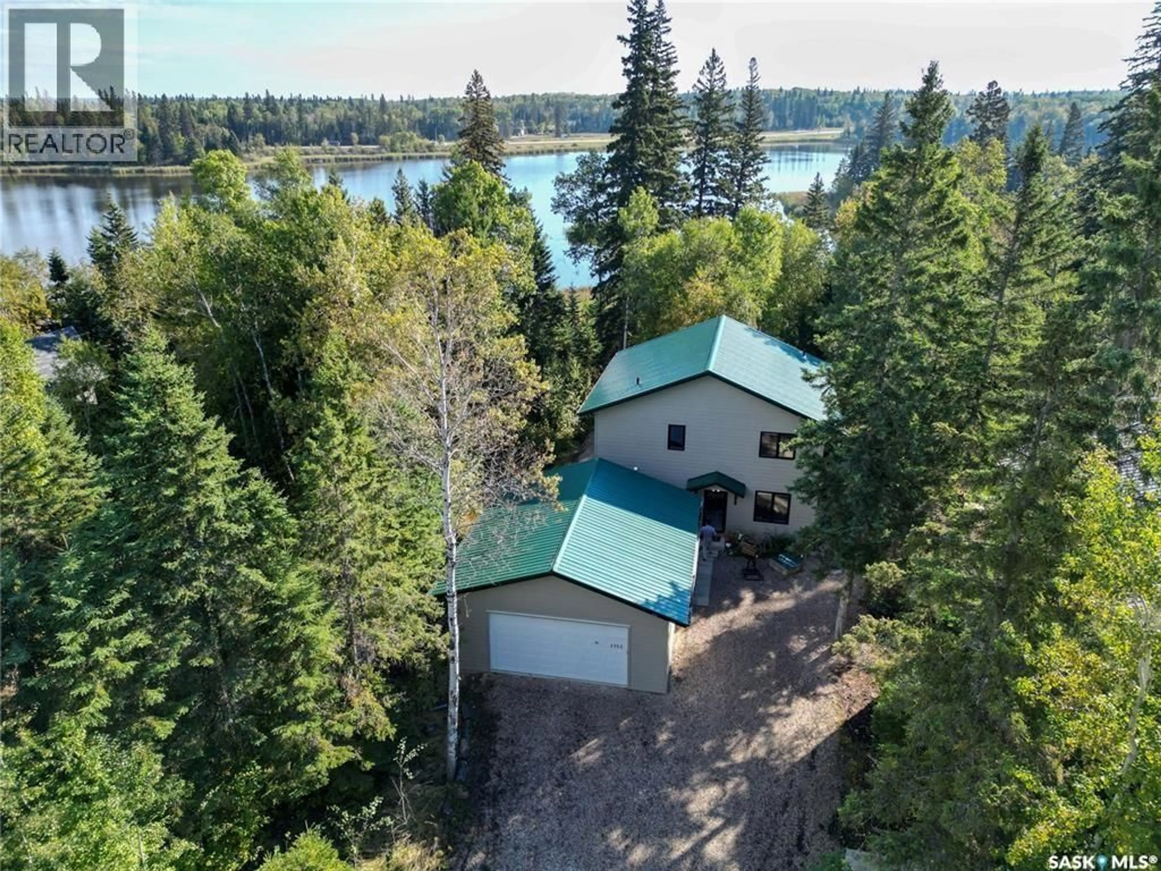 A pic from outside/outdoor area/front of a property/back of a property/a pic from drone, water/lake/river/ocean view for 1305 LAURIE PLACE, Paddockwood Rm No. 520 Saskatchewan S0J0N0