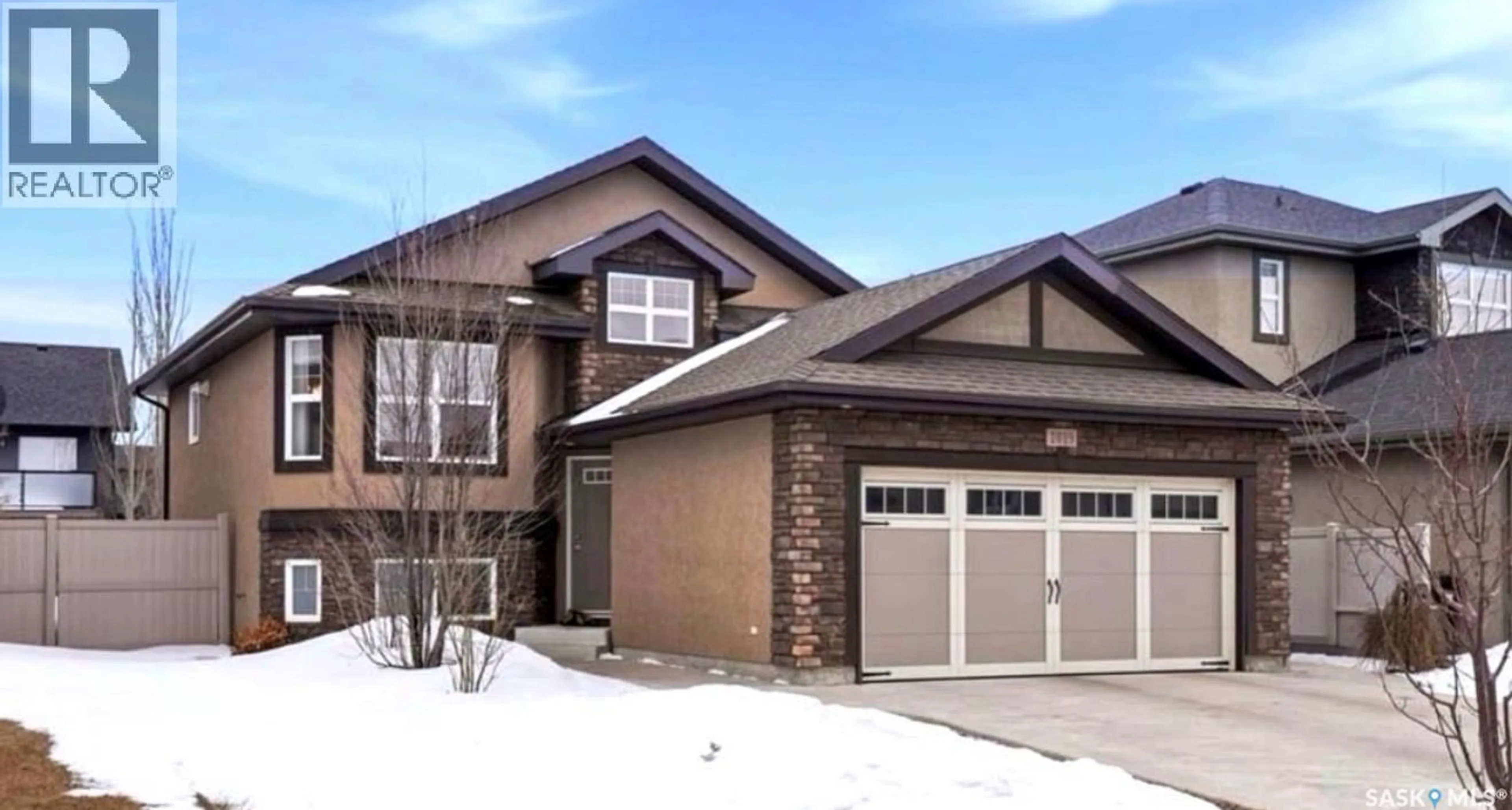 Home with brick exterior material, street for 1019 HUNTER ROAD, Saskatoon Saskatchewan S7T0E6