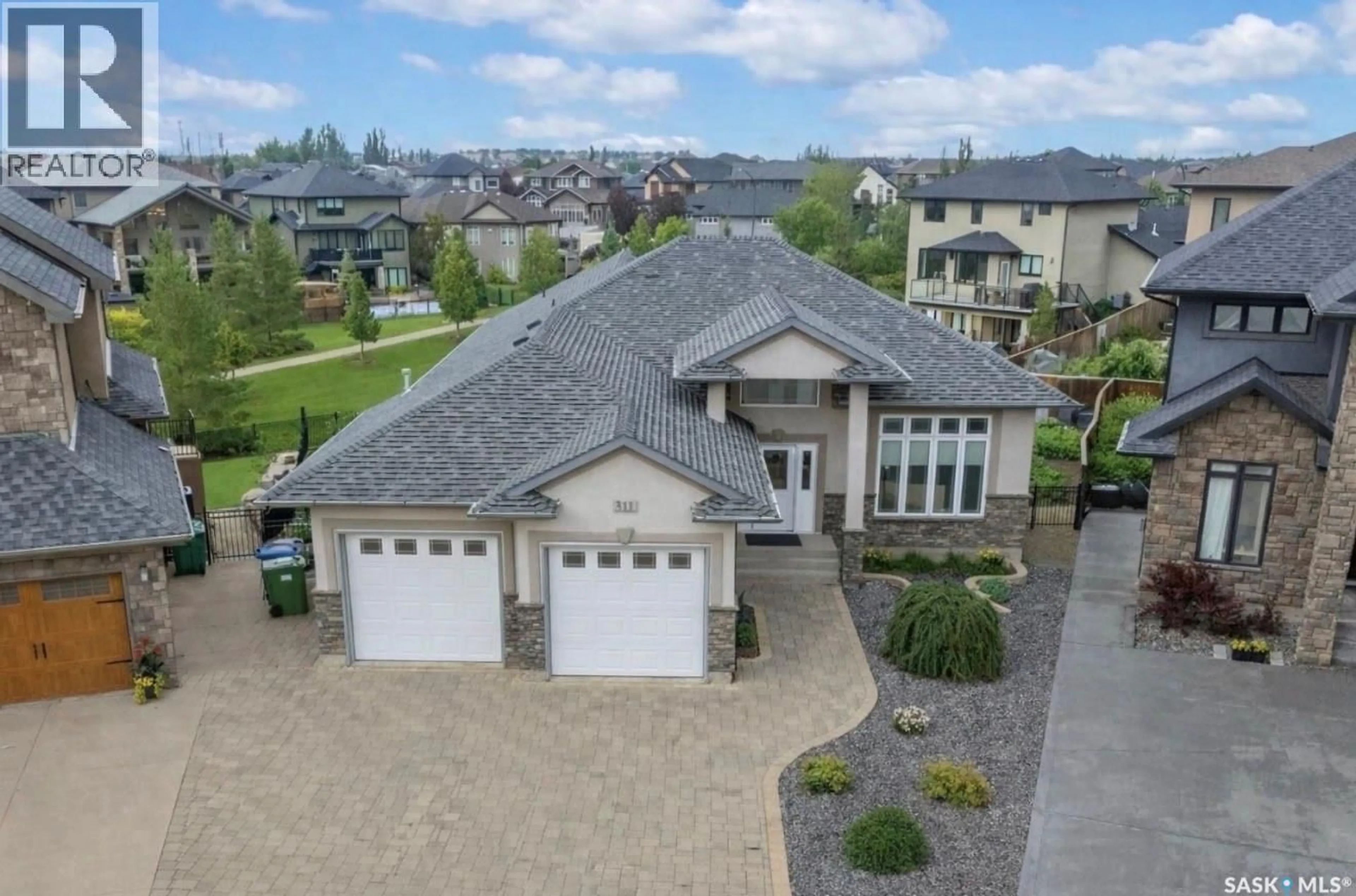 A pic from outside/outdoor area/front of a property/back of a property/a pic from drone, street for 511 BENNION TERRACE, Saskatoon Saskatchewan S7W0H2