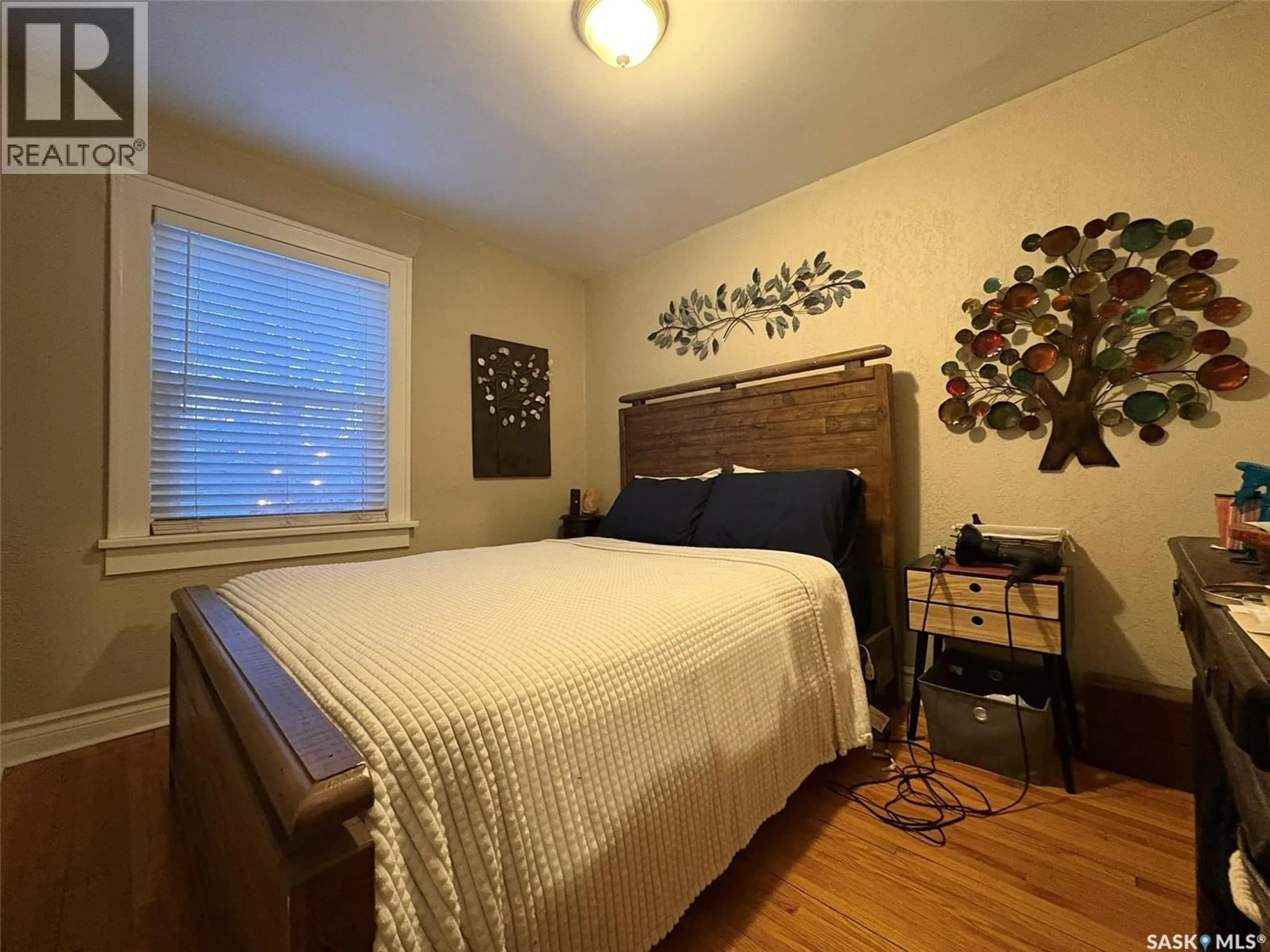 Bedroom with bed, wood/laminate floor for 2470 WALLACE STREET, Regina Saskatchewan S4N4B3